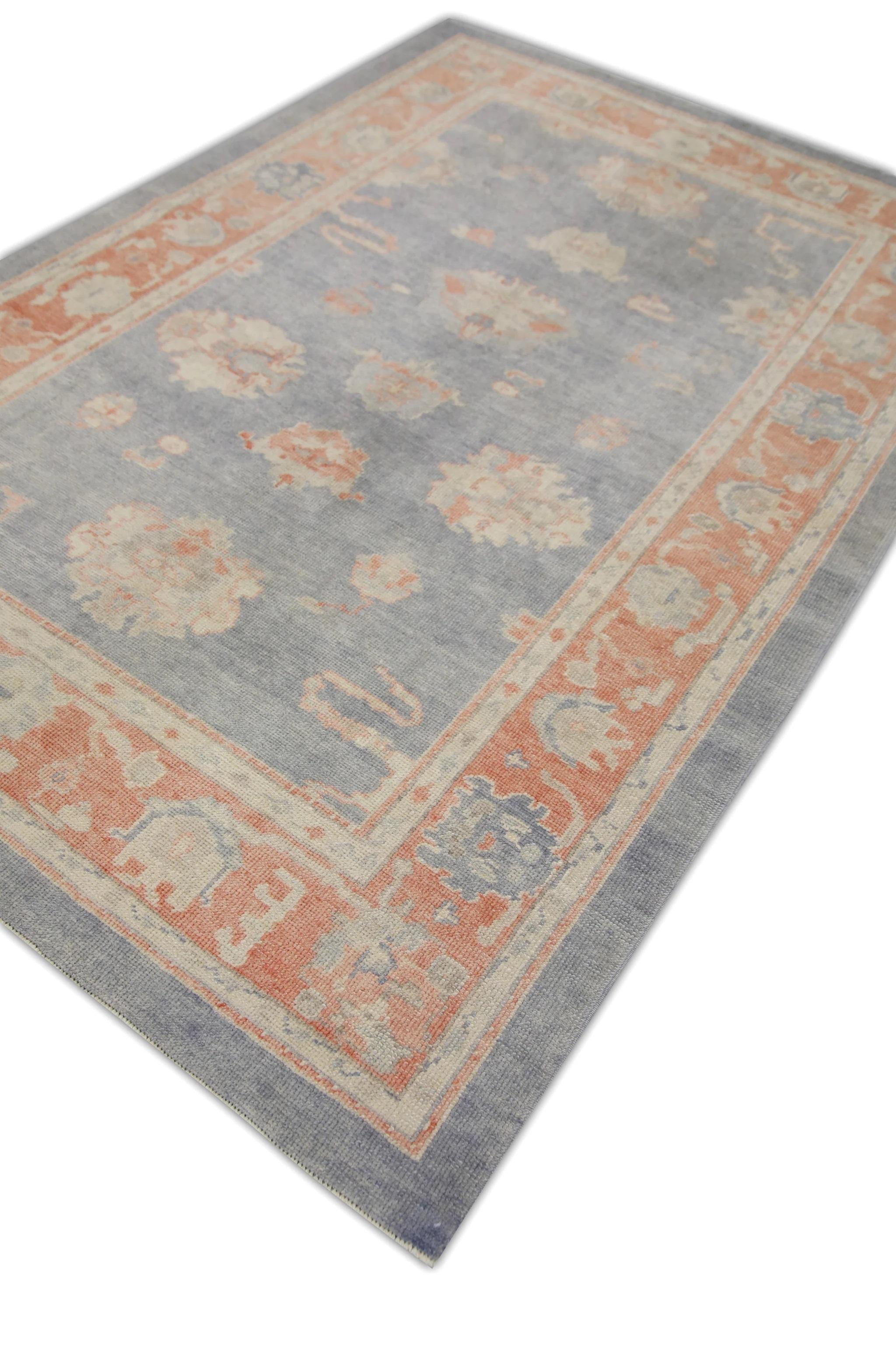 This modern Turkish oushak rug is a stunning piece of art that has been handwoven using traditional techniques by skilled artisans. The rug features intricate patterns and a soft color palette that is achieved through the use of natural vegetable