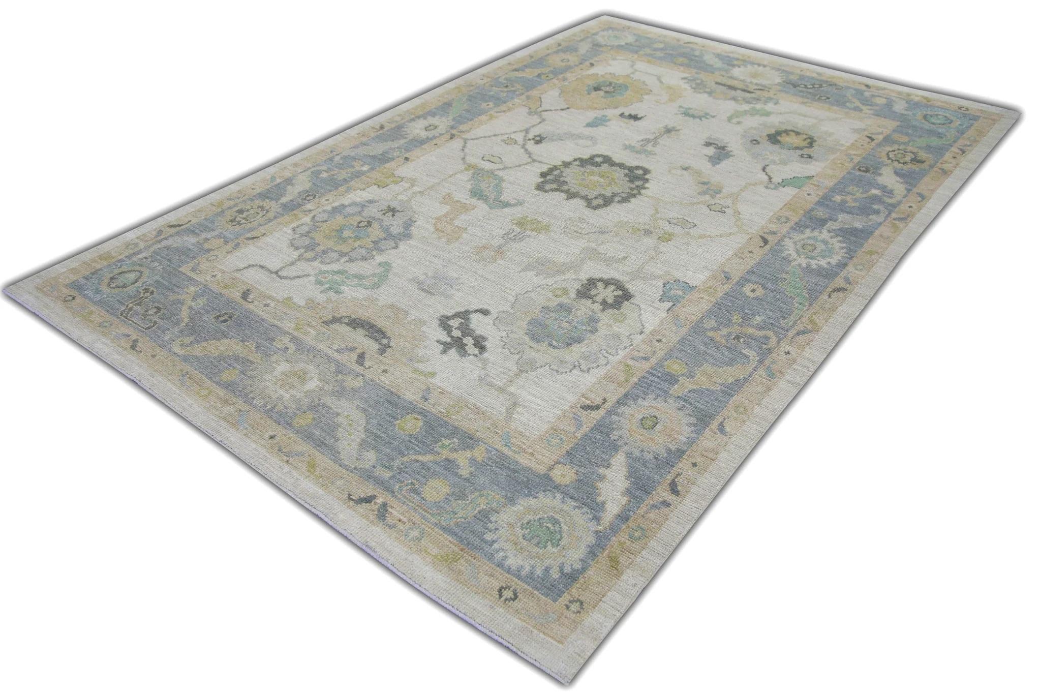 This modern Turkish oushak rug is a stunning piece of art that has been handwoven using traditional techniques by skilled artisans. The rug features intricate patterns and a soft color palette that is achieved through the use of natural vegetable