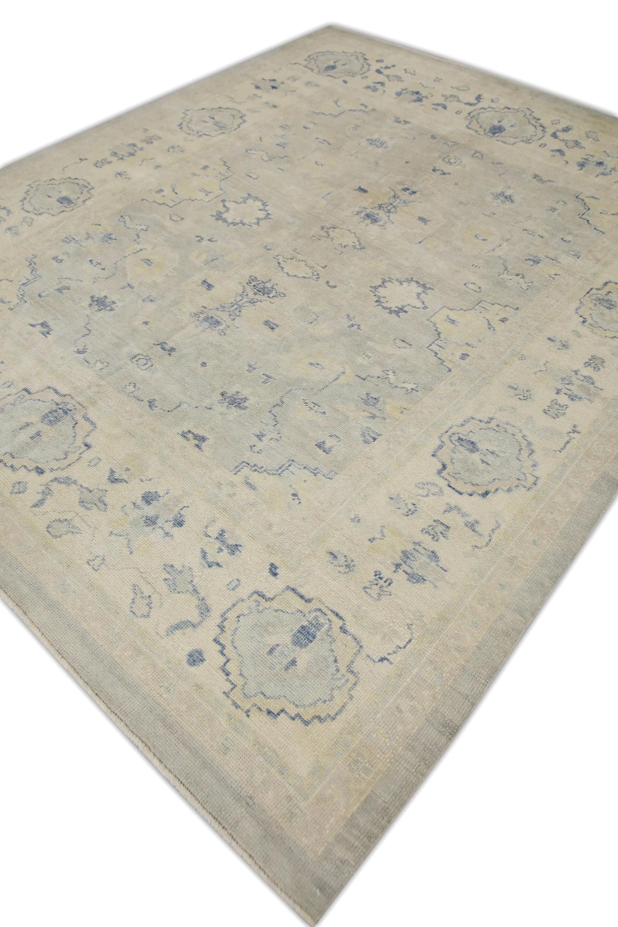 This modern Turkish oushak rug is a stunning piece of art that has been handwoven using traditional techniques by skilled artisans. The rug features intricate patterns and a soft color palette that is achieved through the use of natural vegetable