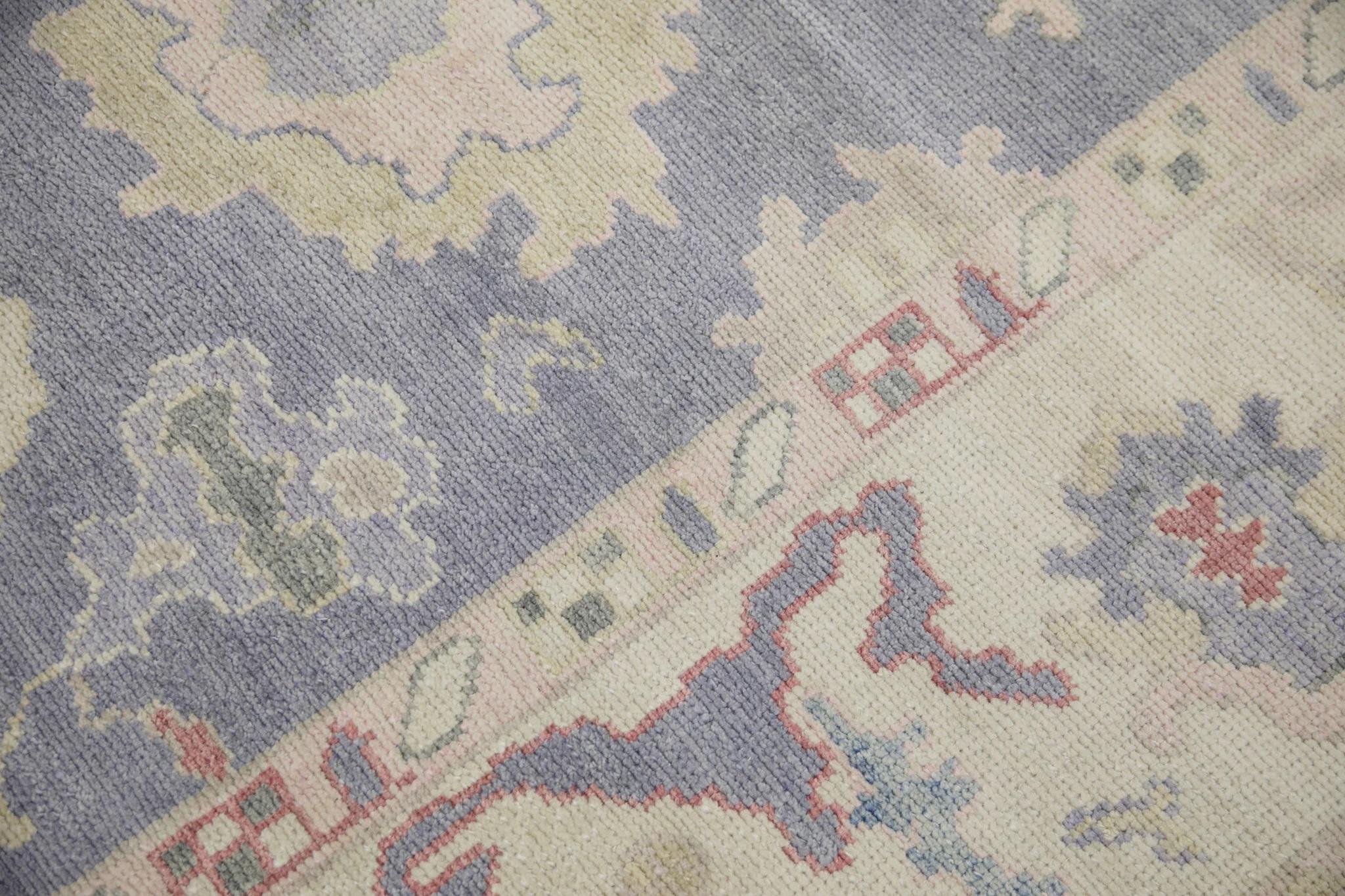 Alfombra turca Oushak de lana tejida a mano con diseño floral rosa y morado 8'5