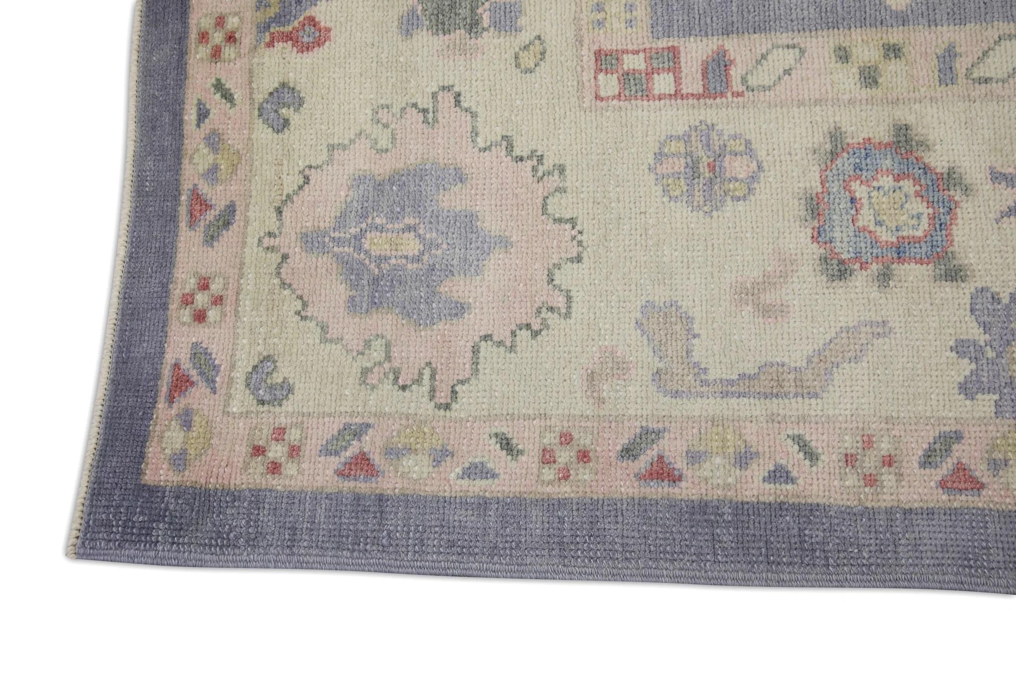 Alfombra turca Oushak de lana tejida a mano con diseño floral rosa y morado 8'5