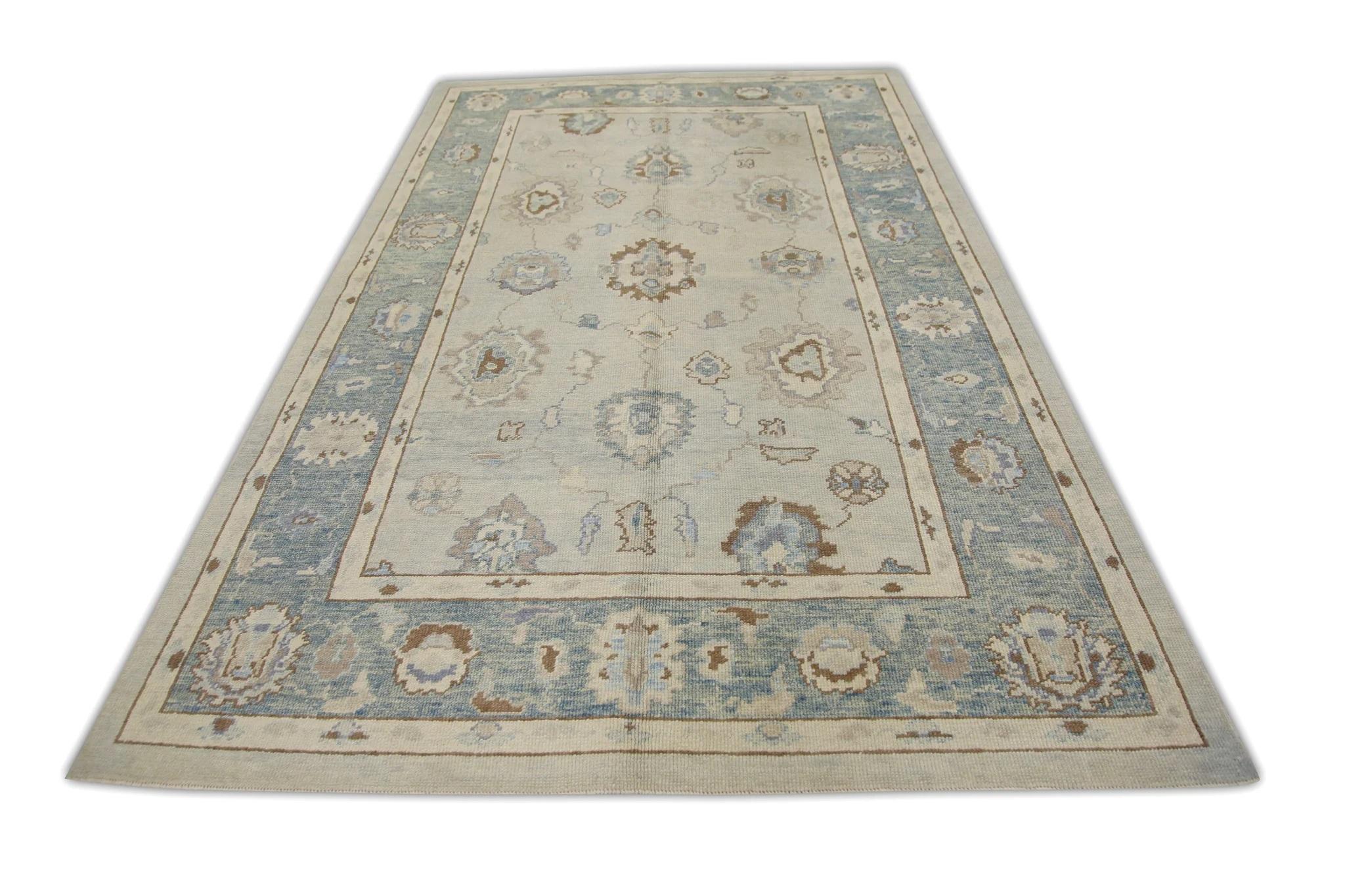 Contemporary Blue and Brown Handwoven Wool Turkish Oushak Rug in Floral Pattern 6' x 9'1