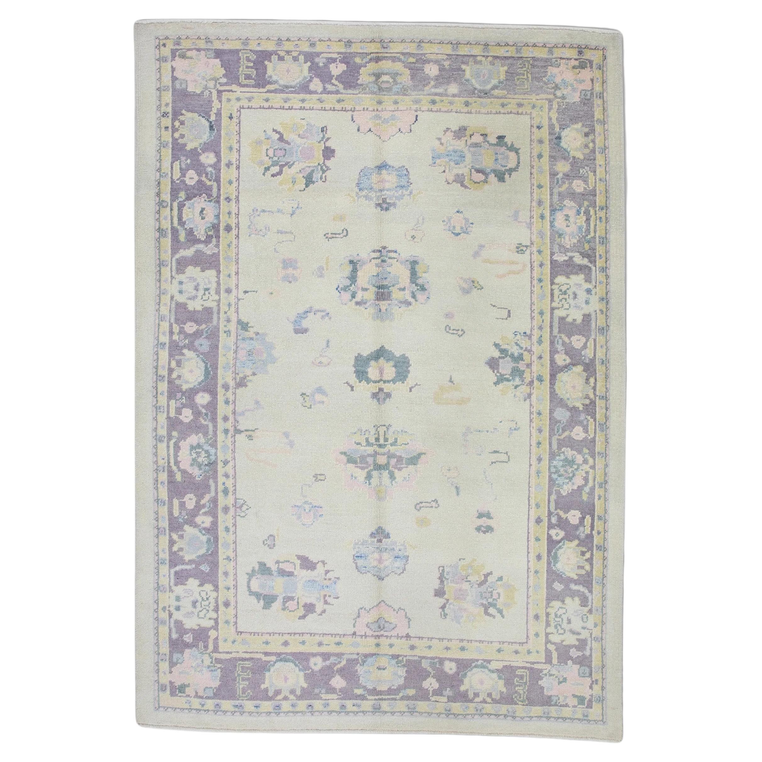 Cream Handwoven Wool Turkish Oushak Rug in Purple Floral Design 6'7" x 8'10" For Sale