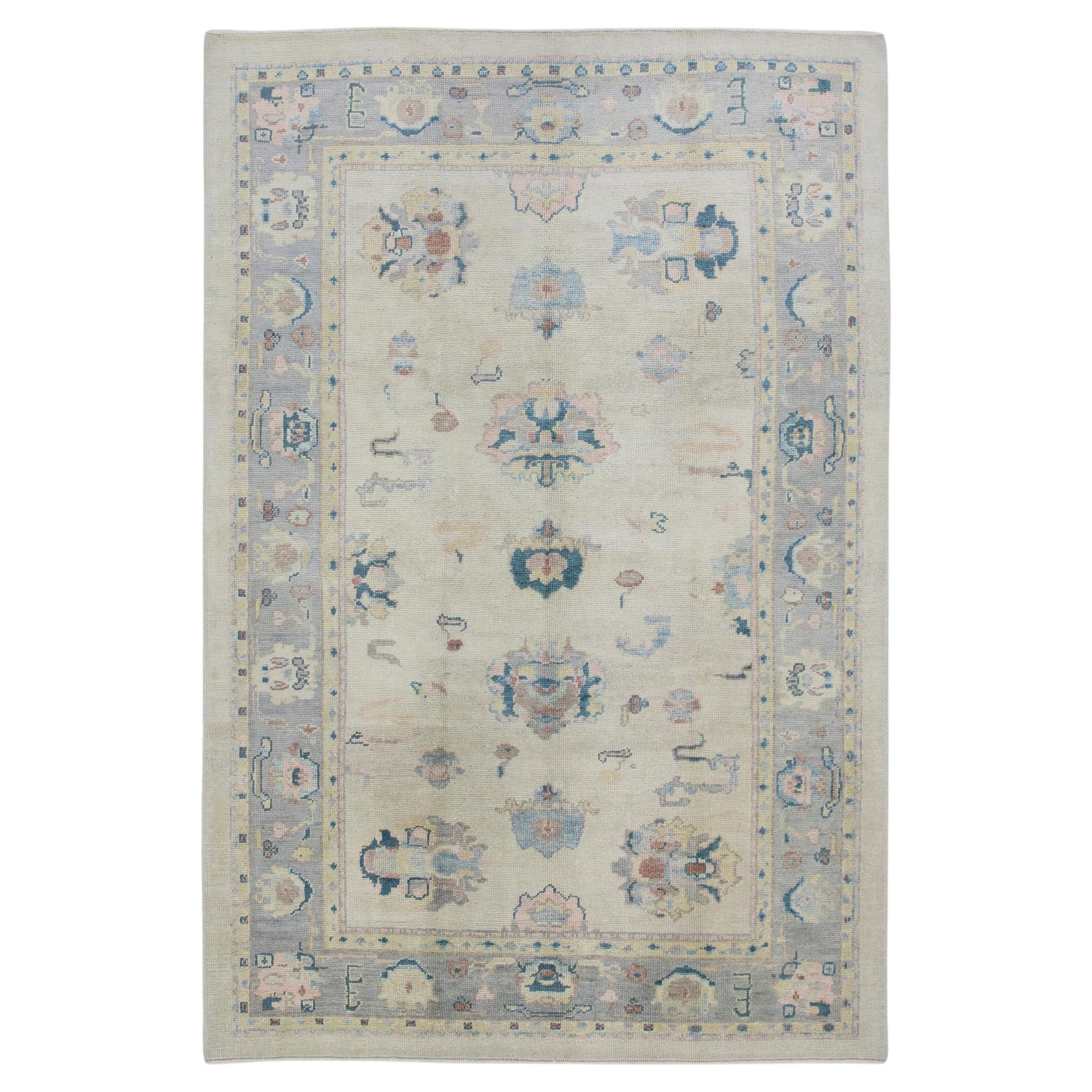 Cream Handwoven Wool Turkish Oushak Rug in Pink & Blue Floral Design 6'1" x 9'1" For Sale