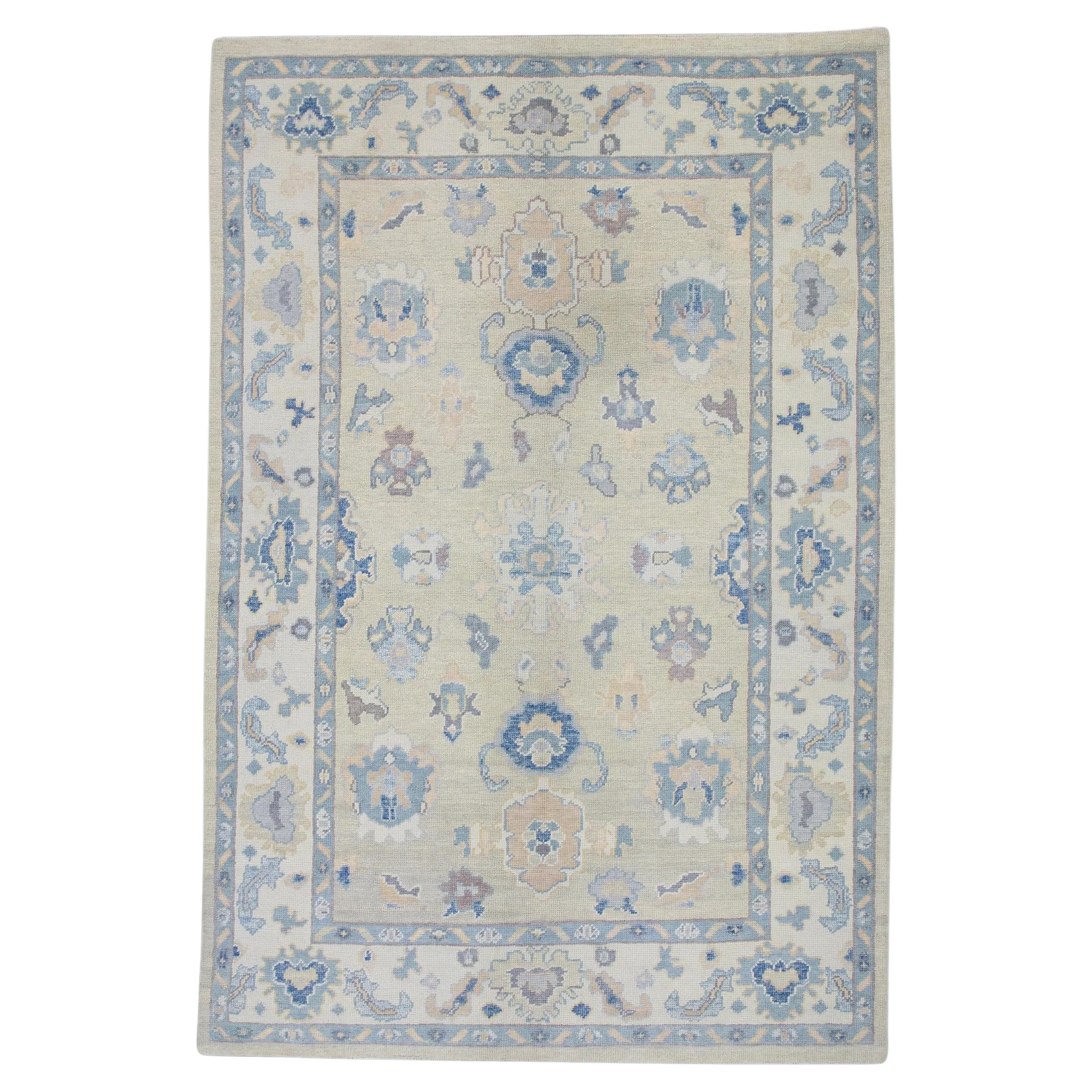 Cream Handwoven Wool Turkish Oushak Rug in Blue Floral Design 6' x 8'10" For Sale