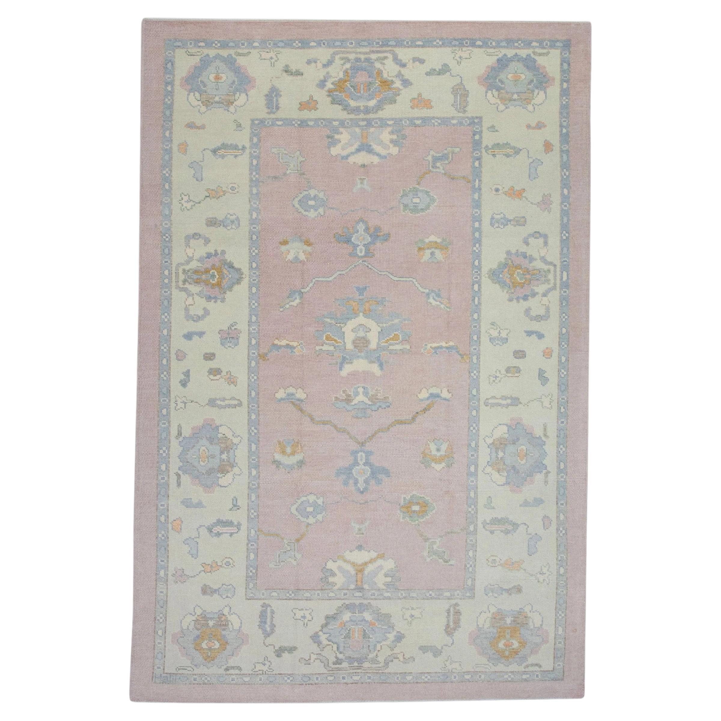 Pink and Blue Handwoven Wool Floral Design Turkish Oushak Rug 6'5" x 9'1" For Sale