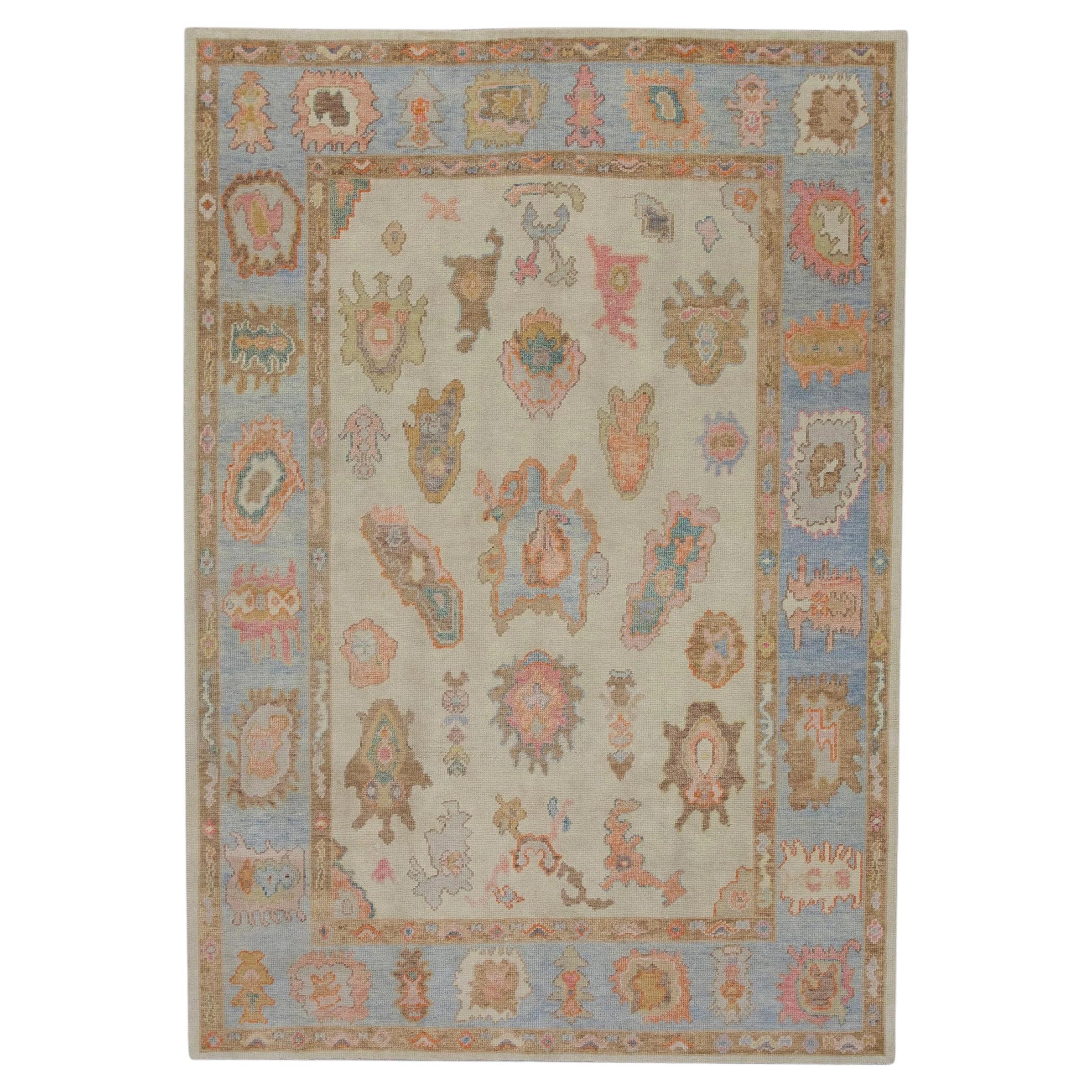 Blue and Pink Floral Design Handwoven Wool Turkish Oushak Rug 6'2" x 8'10" For Sale