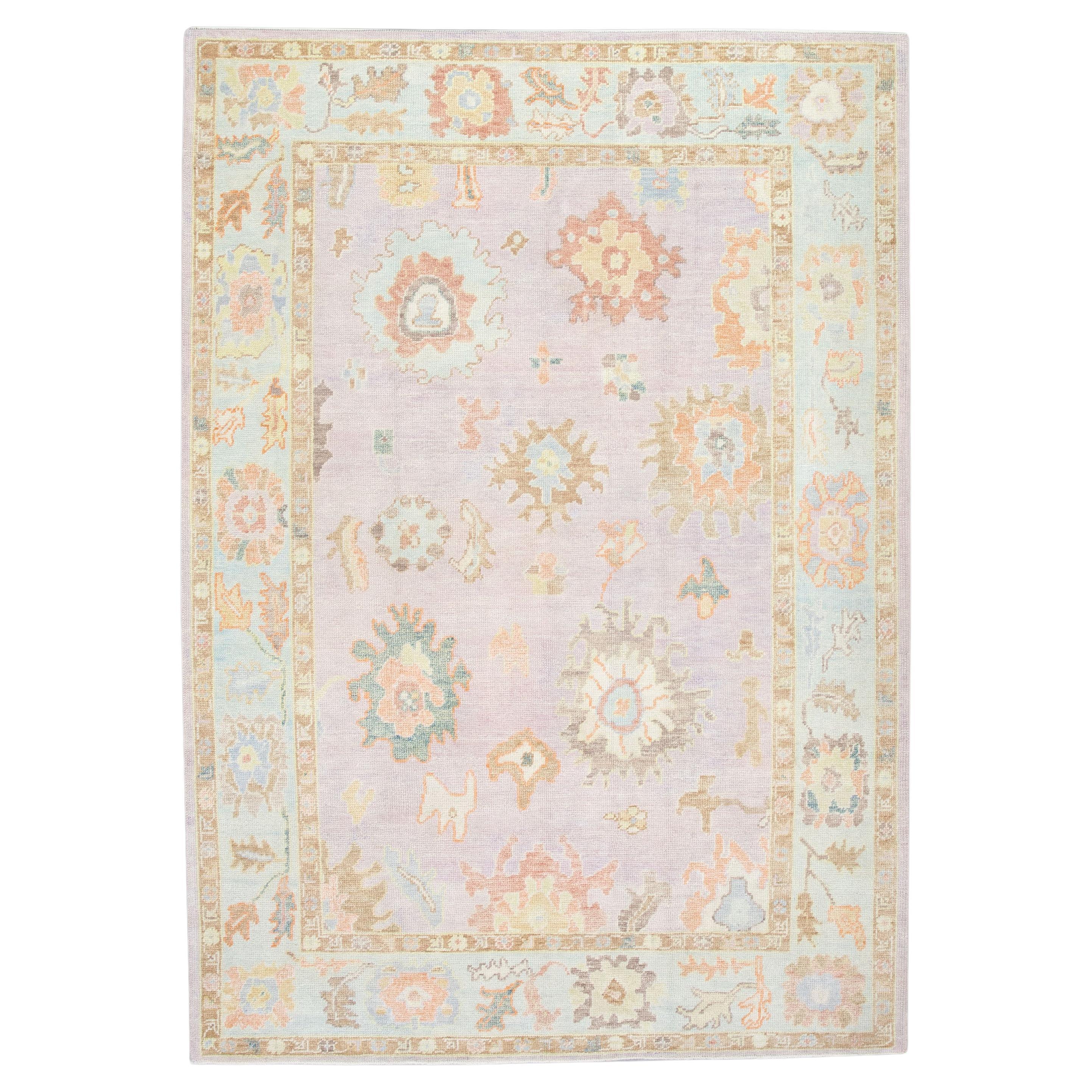 Pink and Blue Floral Design Handwoven Wool Turkish Oushak Rug 6'2" x 8'10" For Sale