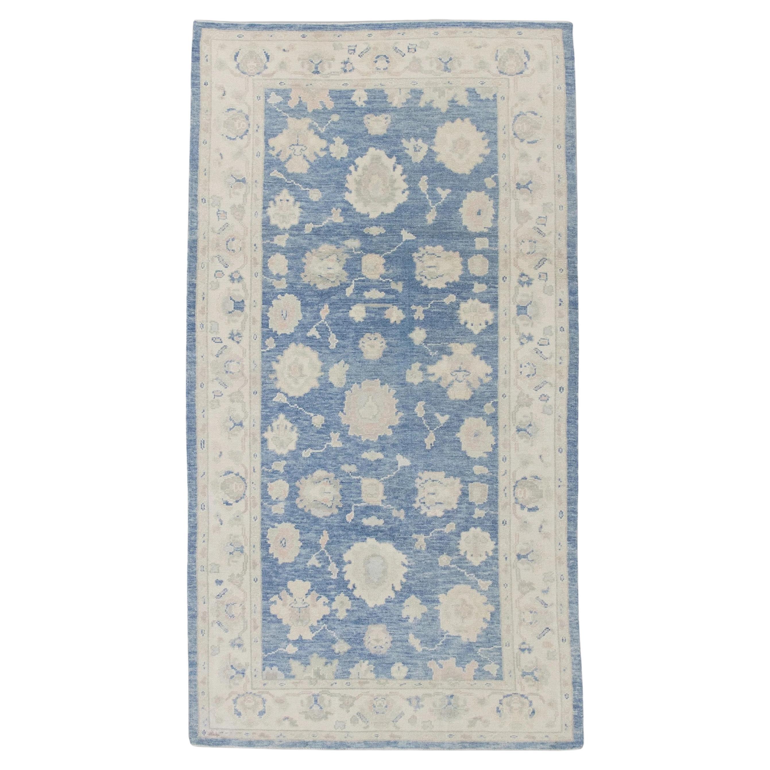 Blue Handwoven Wool Turkish Oushak Rug in Floral Design 5'1" x 9'5" For Sale