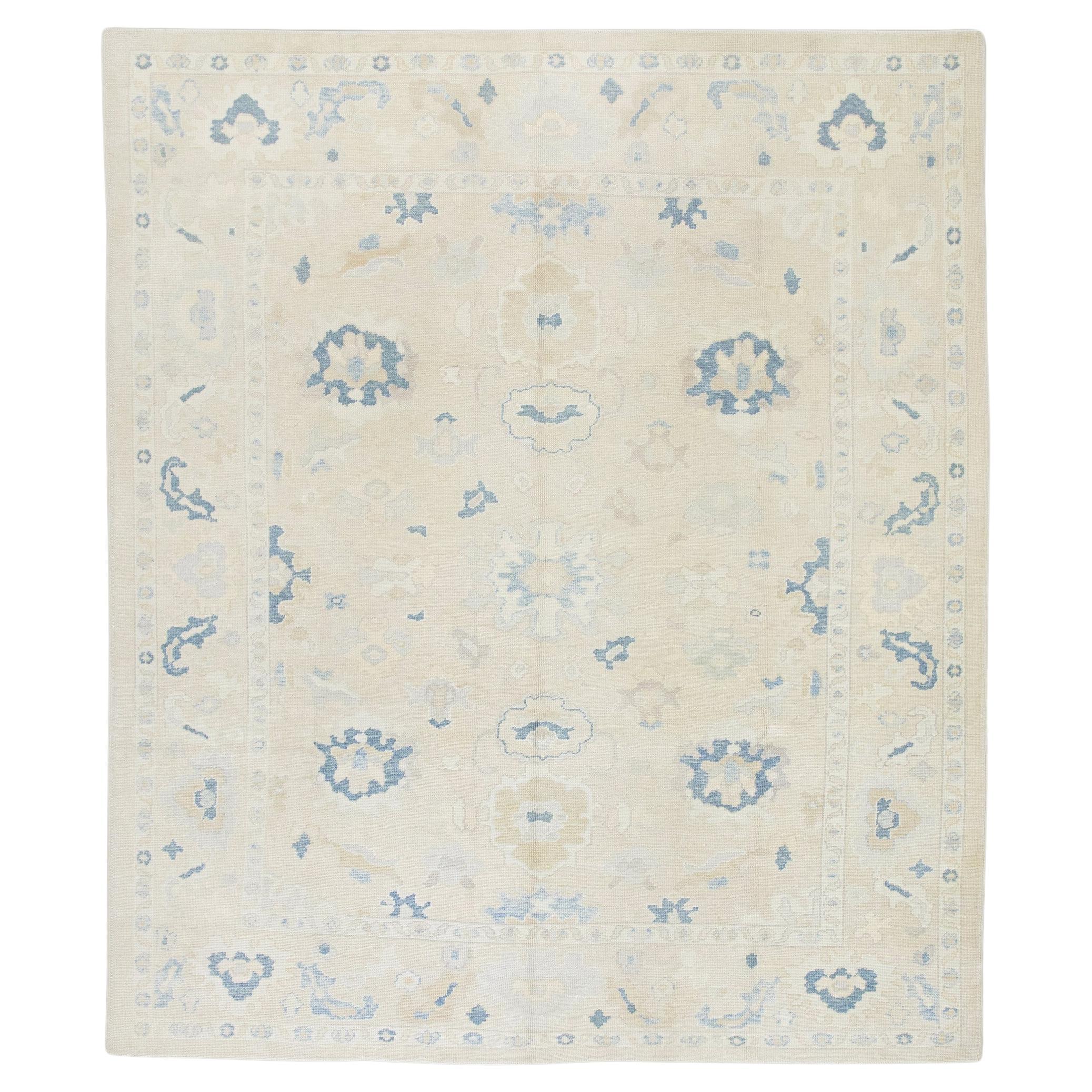 Cream Handwoven Wool Turkish Oushak Rug in Blue Floral Design 8'10" x 10'3" For Sale