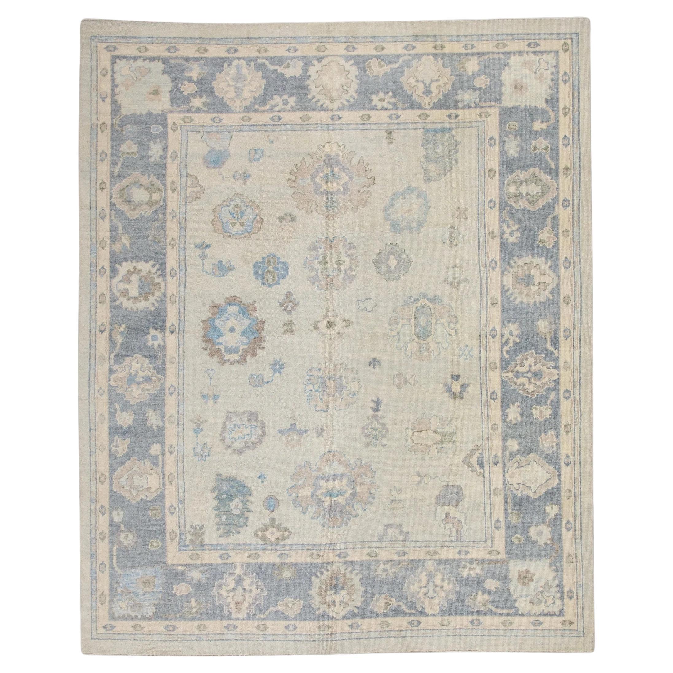 Cream Handwoven Wool Turkish Oushak Rug in Blue Floral Design 8'3" x 10'6" For Sale