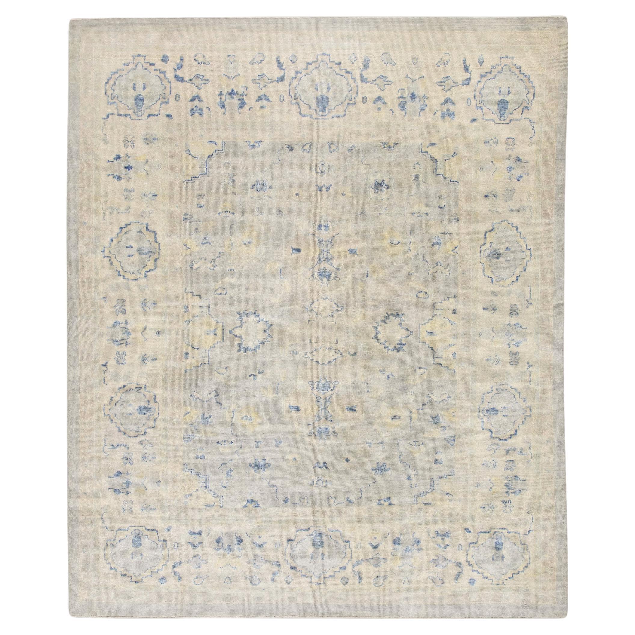 Cream Handwoven Wool Turkish Oushak Rug in Blue Floral Design 8'1" x 9'7" For Sale