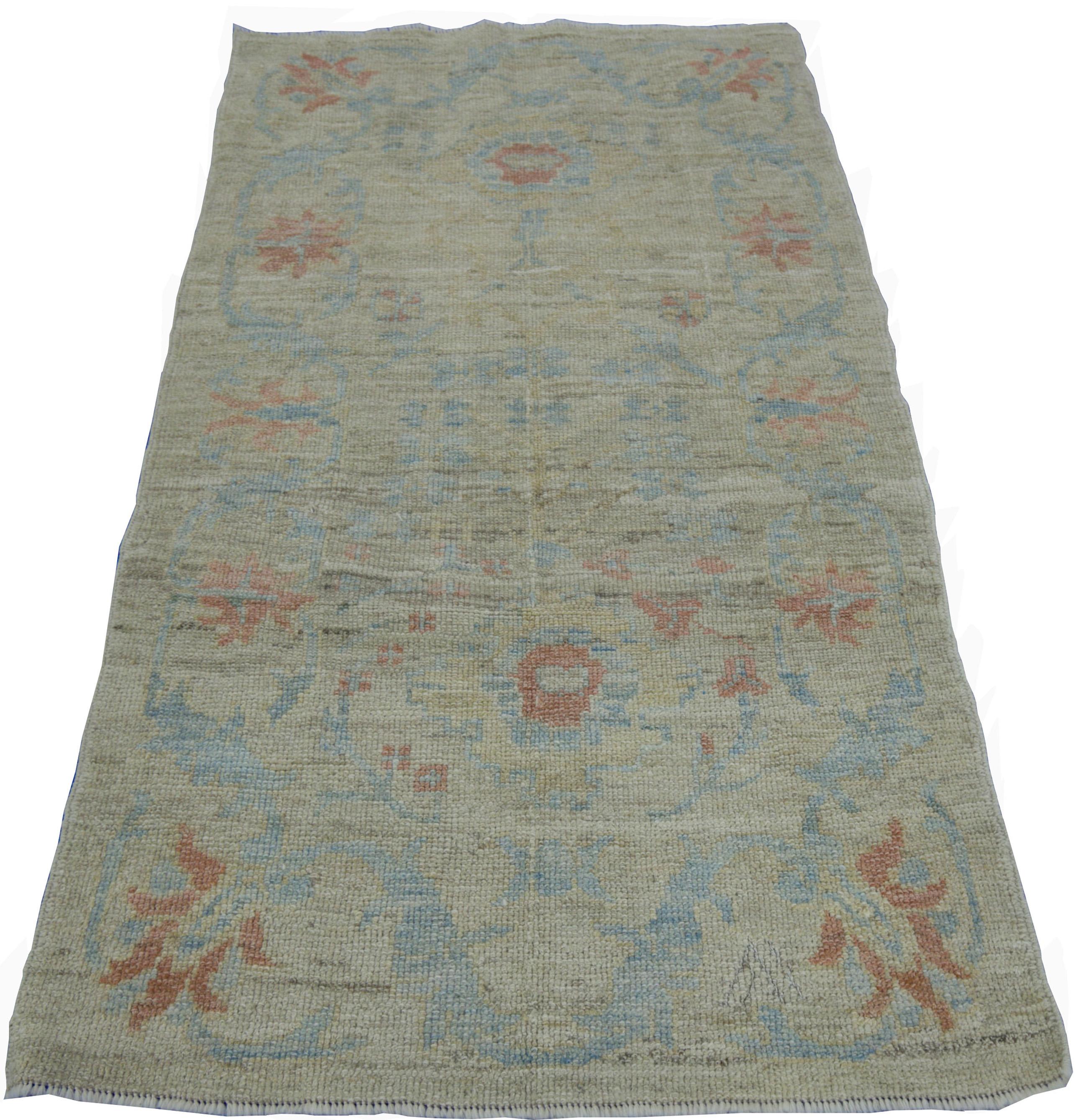 Hand-Woven Modern Turkish Oushak Rug with Borderless Beige Field and Blue Floral Details For Sale
