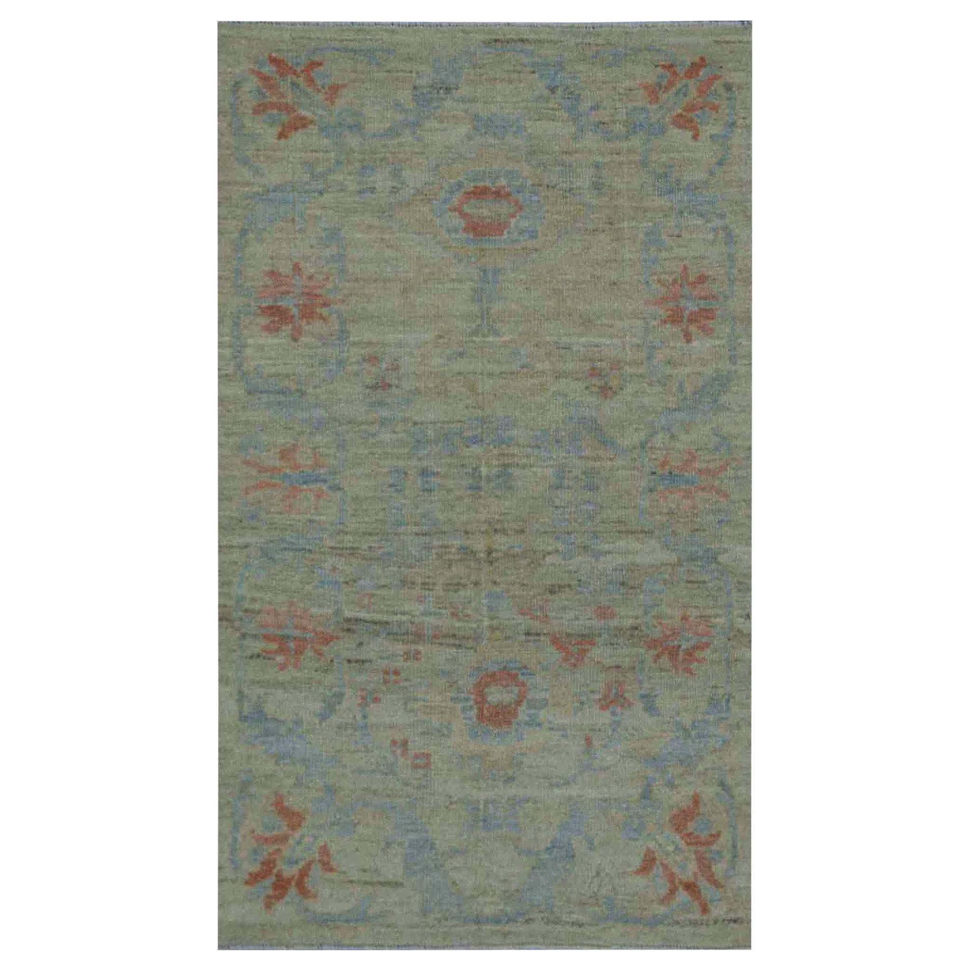 Modern Turkish Oushak Rug with Borderless Beige Field and Blue Floral Details For Sale