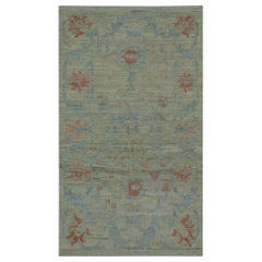 Modern Turkish Oushak Rug with Borderless Beige Field and Blue Floral Details