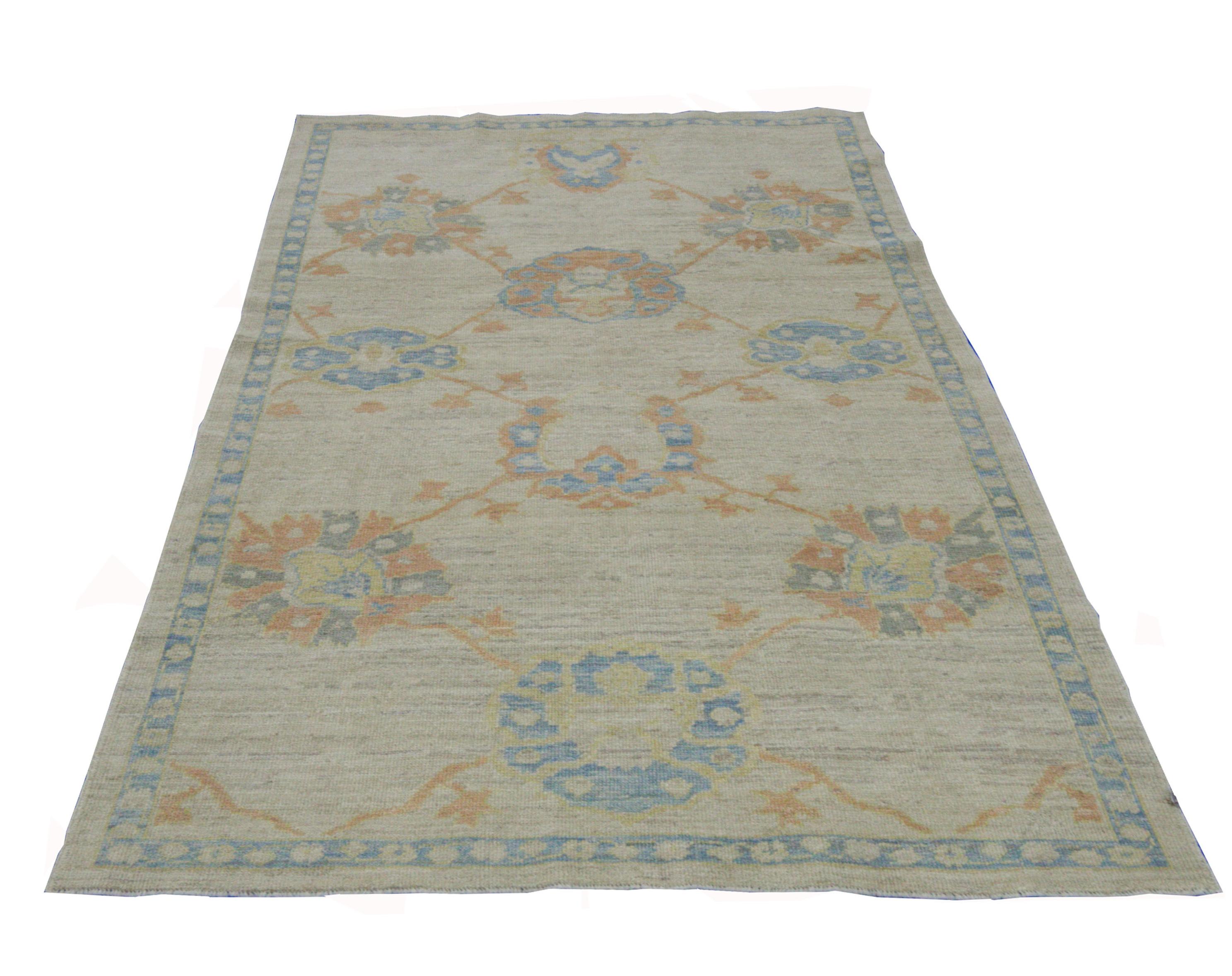 Contemporary Modern Turkish Oushak Rug with Flower Heads in Blue and Orange on Ivory Field For Sale