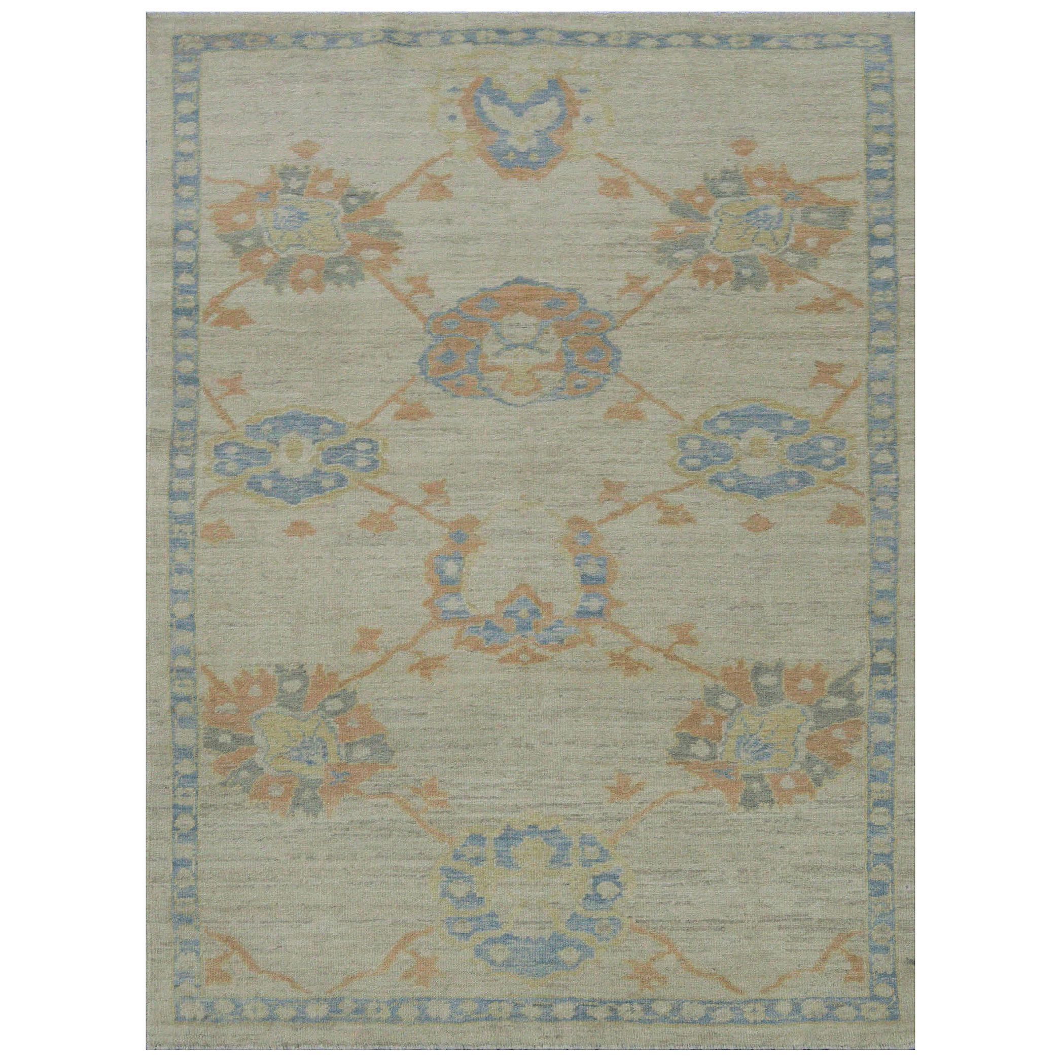 Modern Turkish Oushak Rug with Flower Heads in Blue and Orange on Ivory Field