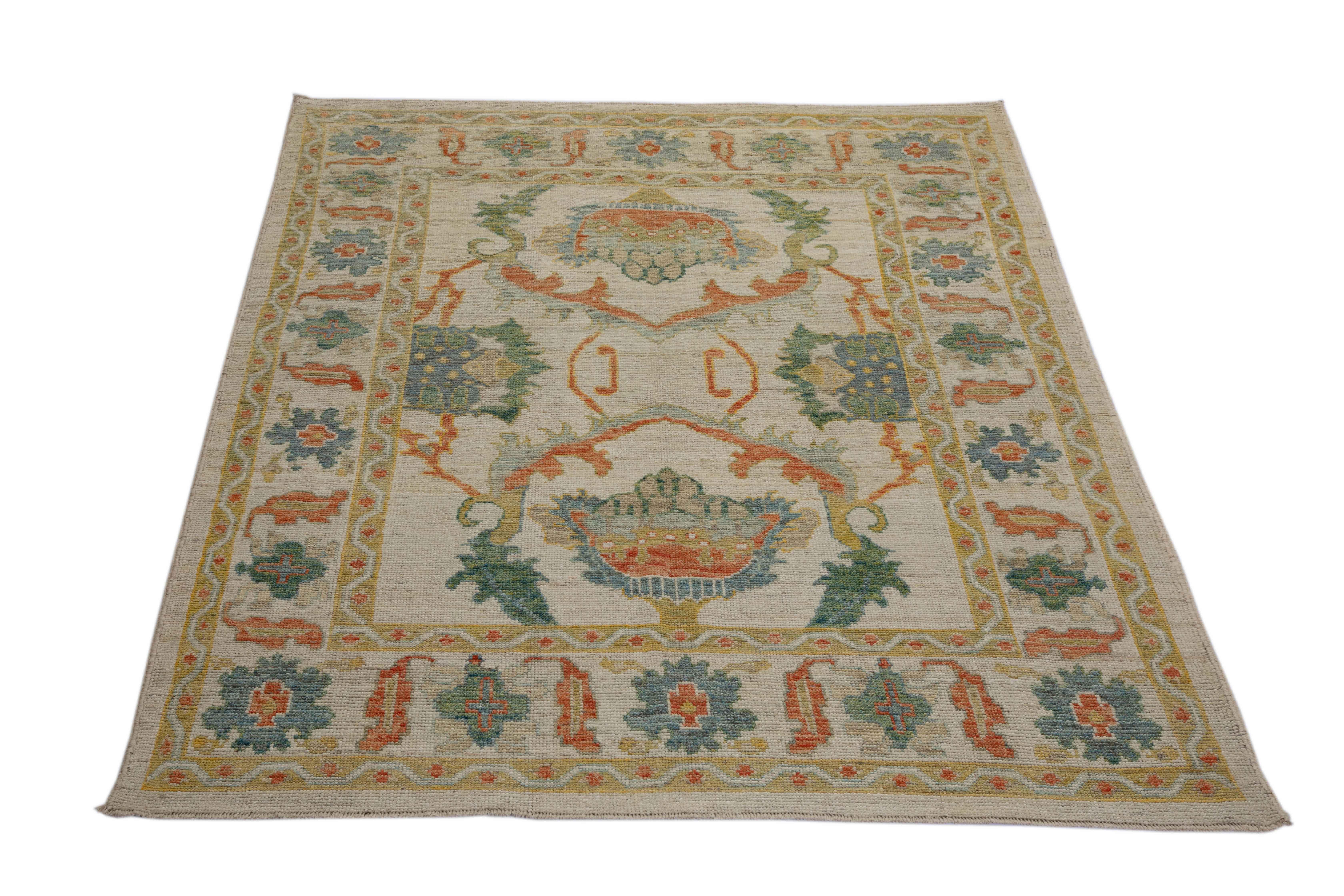 New Turkish rug made of handwoven sheep’s wool of the finest quality. It’s colored with organic vegetable dyes that are certified safe for humans and pets alike. It features a large, beige field with green and rust flower details allover associated