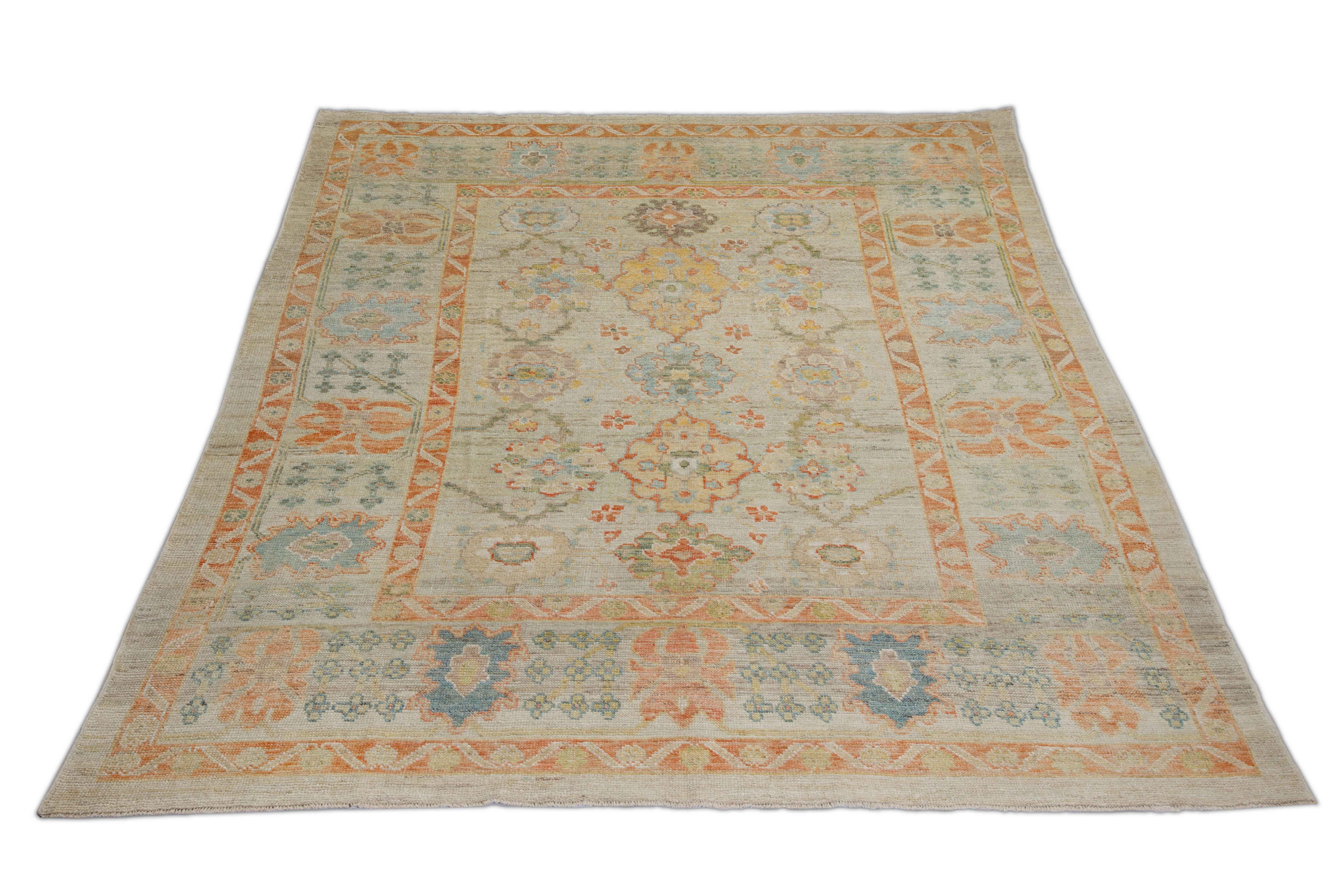 New Turkish rug made of handwoven sheep’s wool of the finest quality. It’s colored with organic vegetable dyes that are certified safe for humans and pets alike. It features a large, beige field with blue and orange flower medallions allover