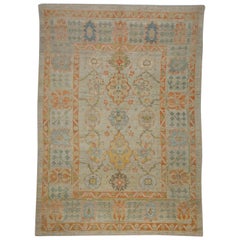 Modern Turkish Oushak Rug with Ornate Blue and Orange Flower Patterns