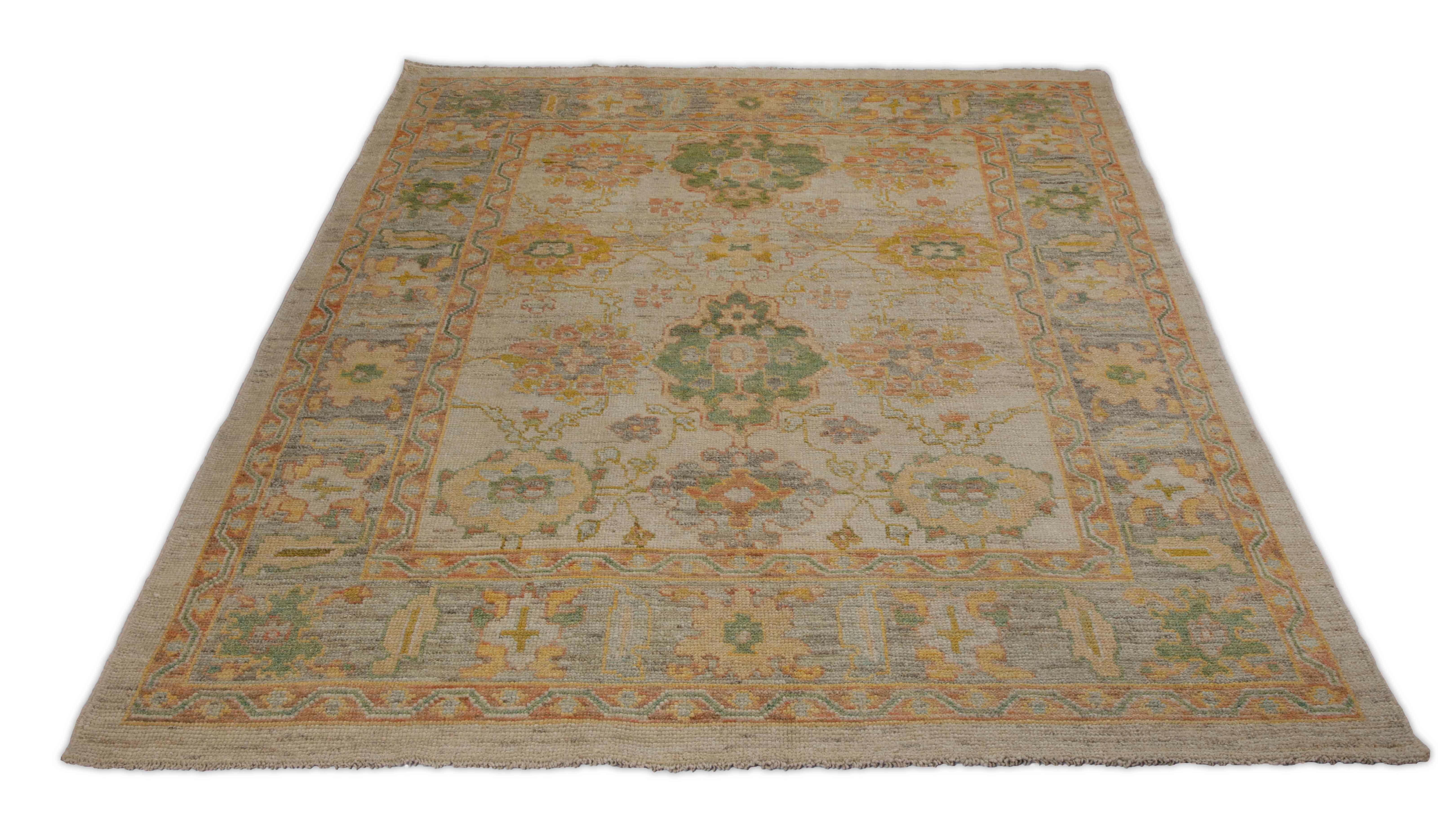 New Turkish rug made of handwoven sheep’s wool of the finest quality. It’s colored with organic vegetable dyes that are certified safe for humans and pets alike. It features a large, beige field with flower medallions allover associated with Oushak