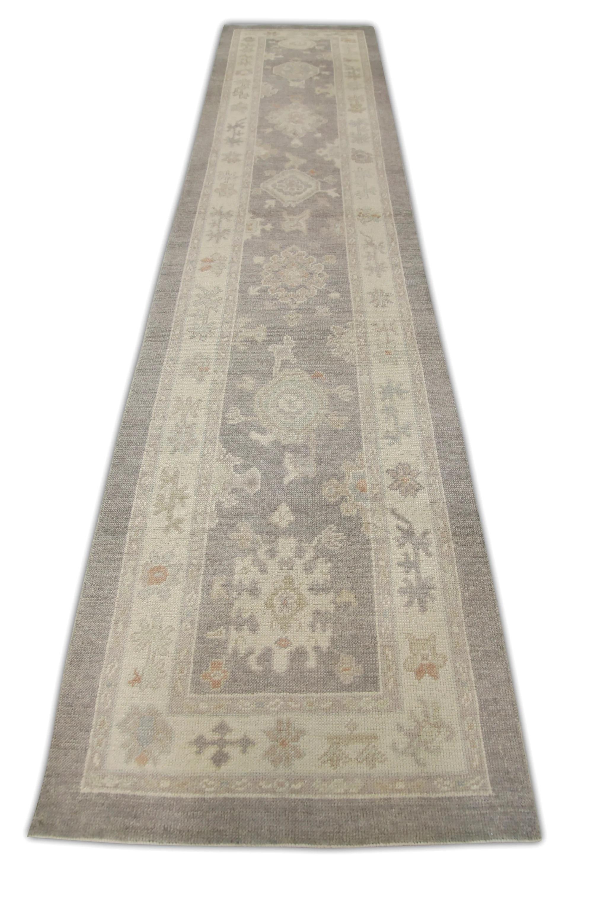 This modern Turkish oushak rug is a stunning piece of art that has been handwoven using traditional techniques by skilled artisans. The rug features intricate patterns and a soft color palette that is achieved through the use of natural vegetable