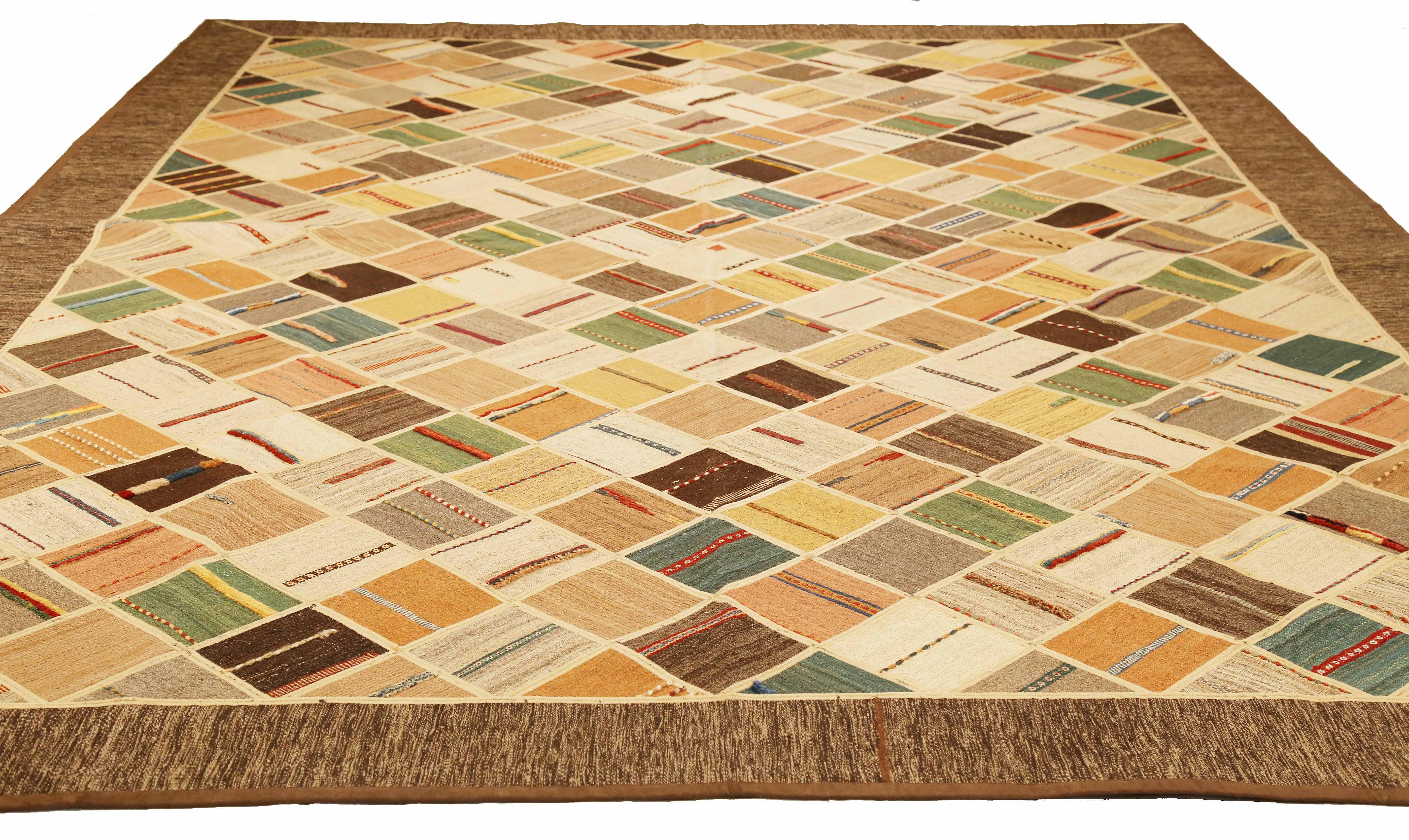 Modern Turkish rug handwoven from the finest sheep’s wool and colored with all-natural vegetable dyes that are safe for humans and pets. It’s a traditional Patch Kilim flat-weave design featuring vibrant and colorful diagonal tile patterns on a