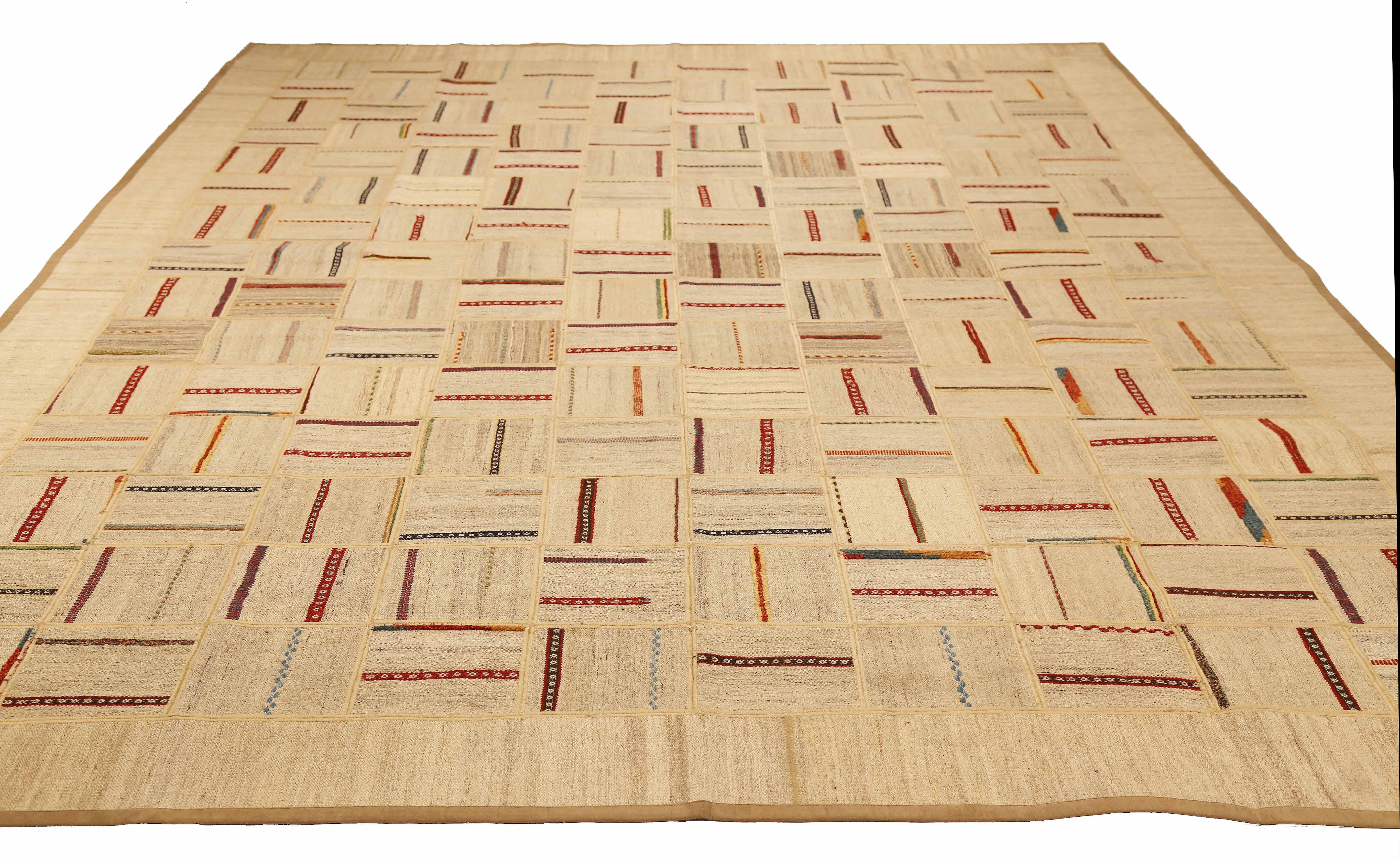 Modern Turkish rug handwoven from the finest sheep’s wool and colored with all-natural vegetable dyes that are safe for humans and pets. It’s a traditional Patch Kilim flat-weave design featuring vibrant and colorful tribal bands on a beige and