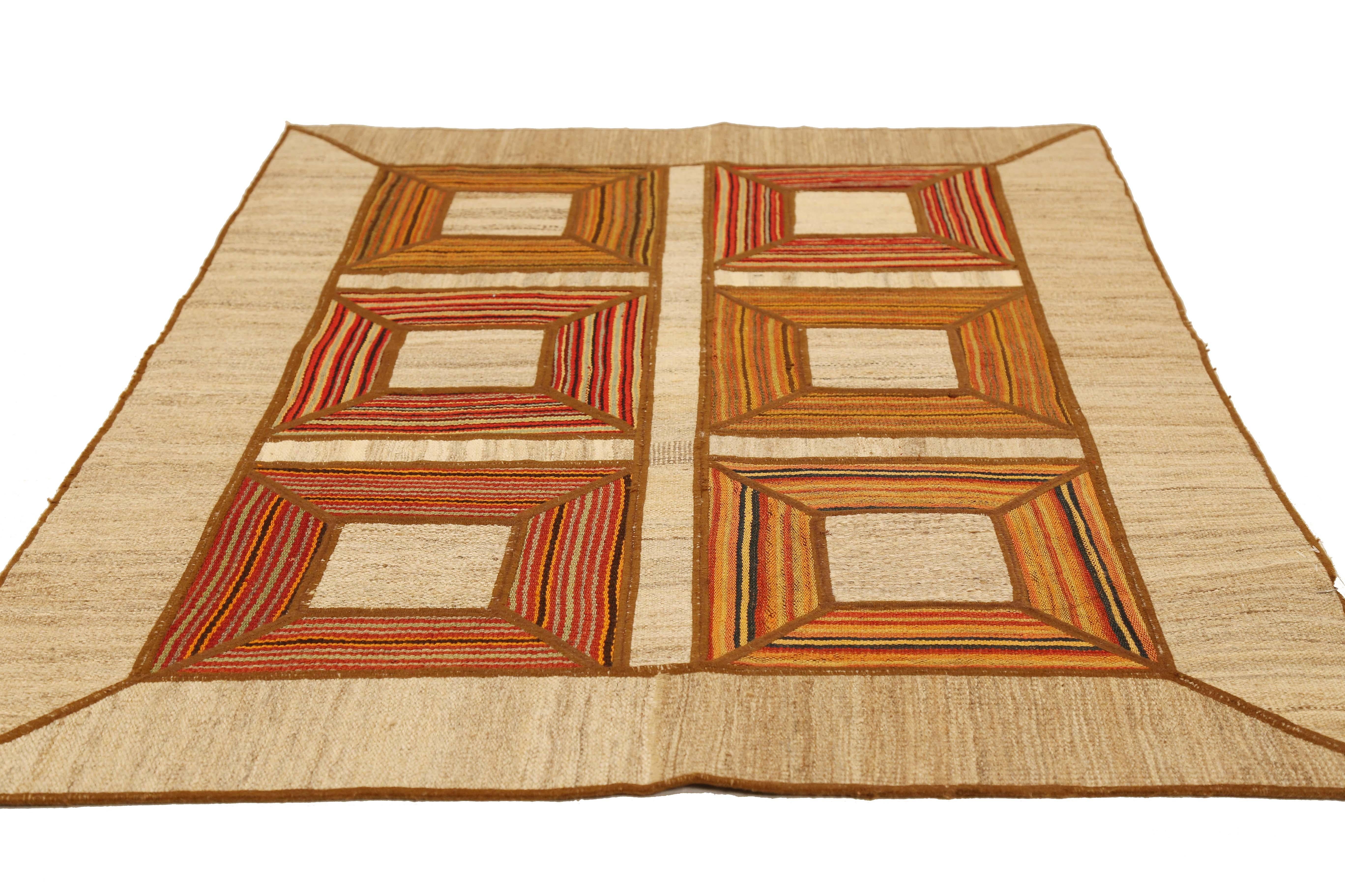 Modern Turkish rug handwoven from the finest sheep’s wool and colored with all-natural vegetable dyes that are safe for humans and pets. It’s a traditional Patch Kilim flat-weave design featuring square patterns in orange and red on a brown field.