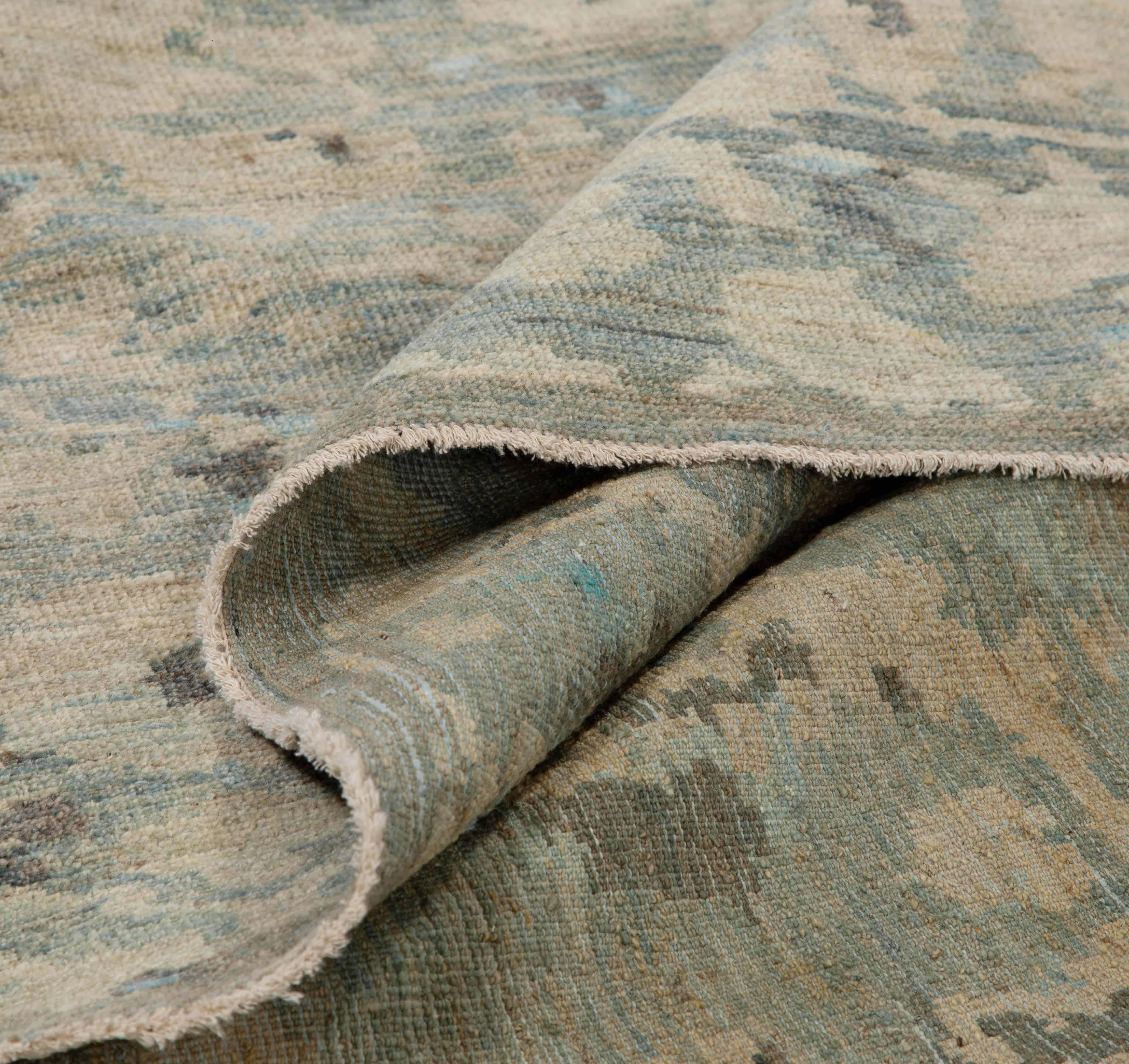 Handmade Turkish area rug from high quality sheep’s wool and colored with eco-friendly vegetable dyes that are proven safe for humans and pets alike. It’s a unique Sultanabad design showcasing a gorgeous mix of blue, beige and gray field of Herati