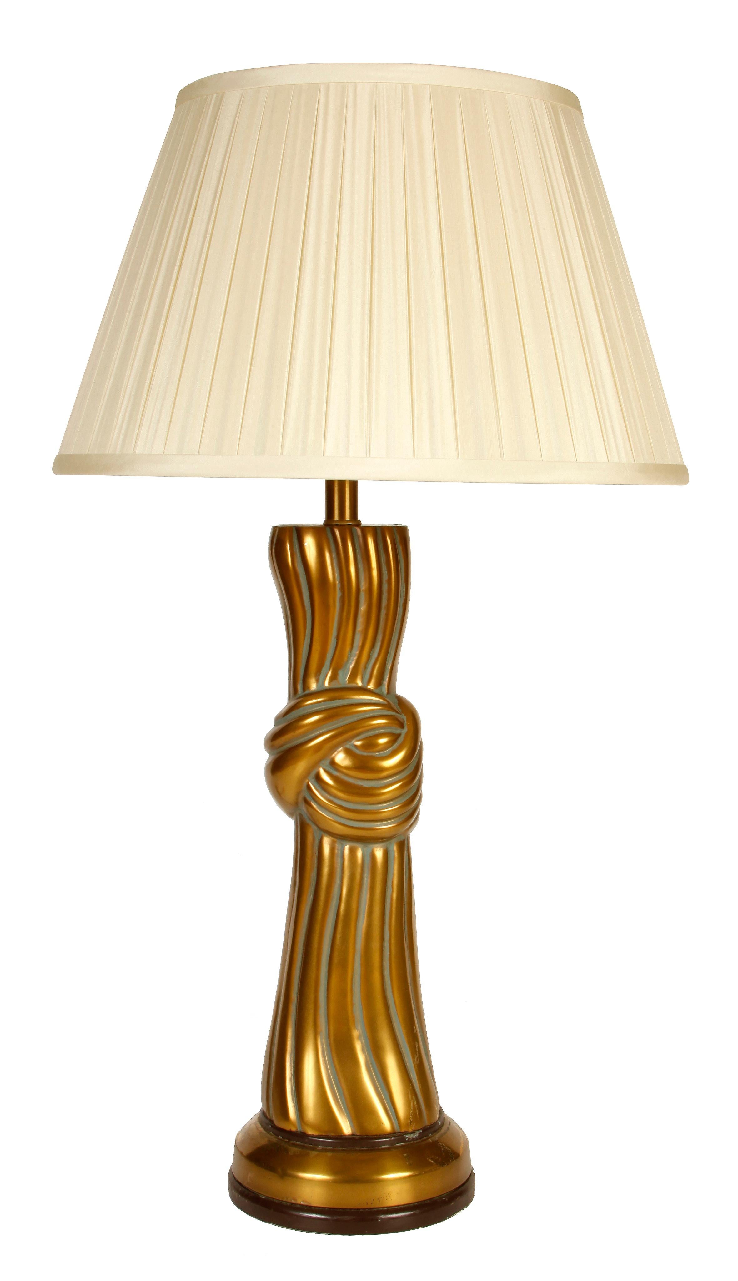 Modern twisted rope knot brass lamp.