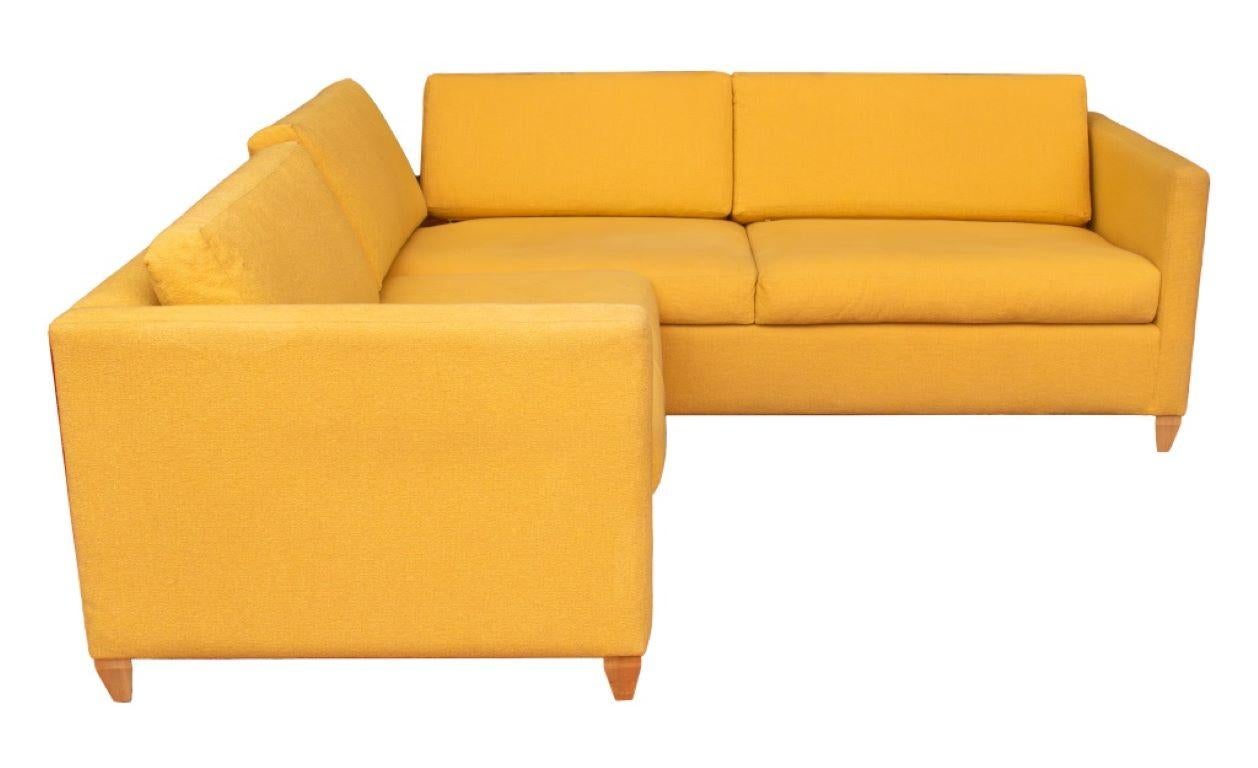 Modern Two-Piece Sectional Corner Sofa with corner cut-out and yellow upholstery on tapered wood feet. Provenance: From a Riverside Drive Collection. 