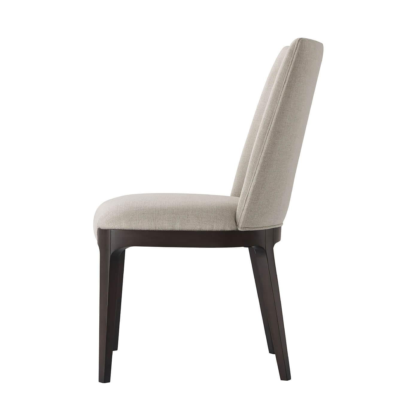 Modern upholstered dining side chair with solid beech and a dark Macadamia finish. With a scoop barrel back and tightly upholstered seat cushion on clamped tapering legs.

Dimensions:
20.25
