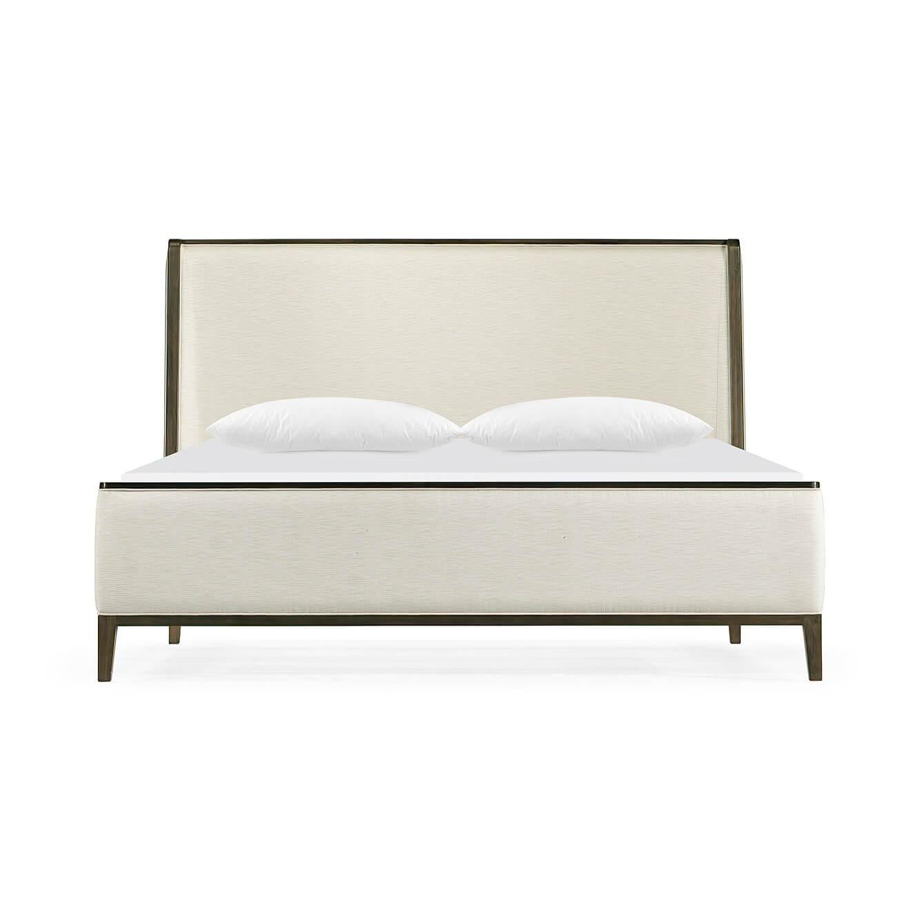 A modern upholstered king size bed with a hand rubbed Acacia frame, a winged back headboard, and raised on out flaring square tapered legs.

Dimensions: 81.75
