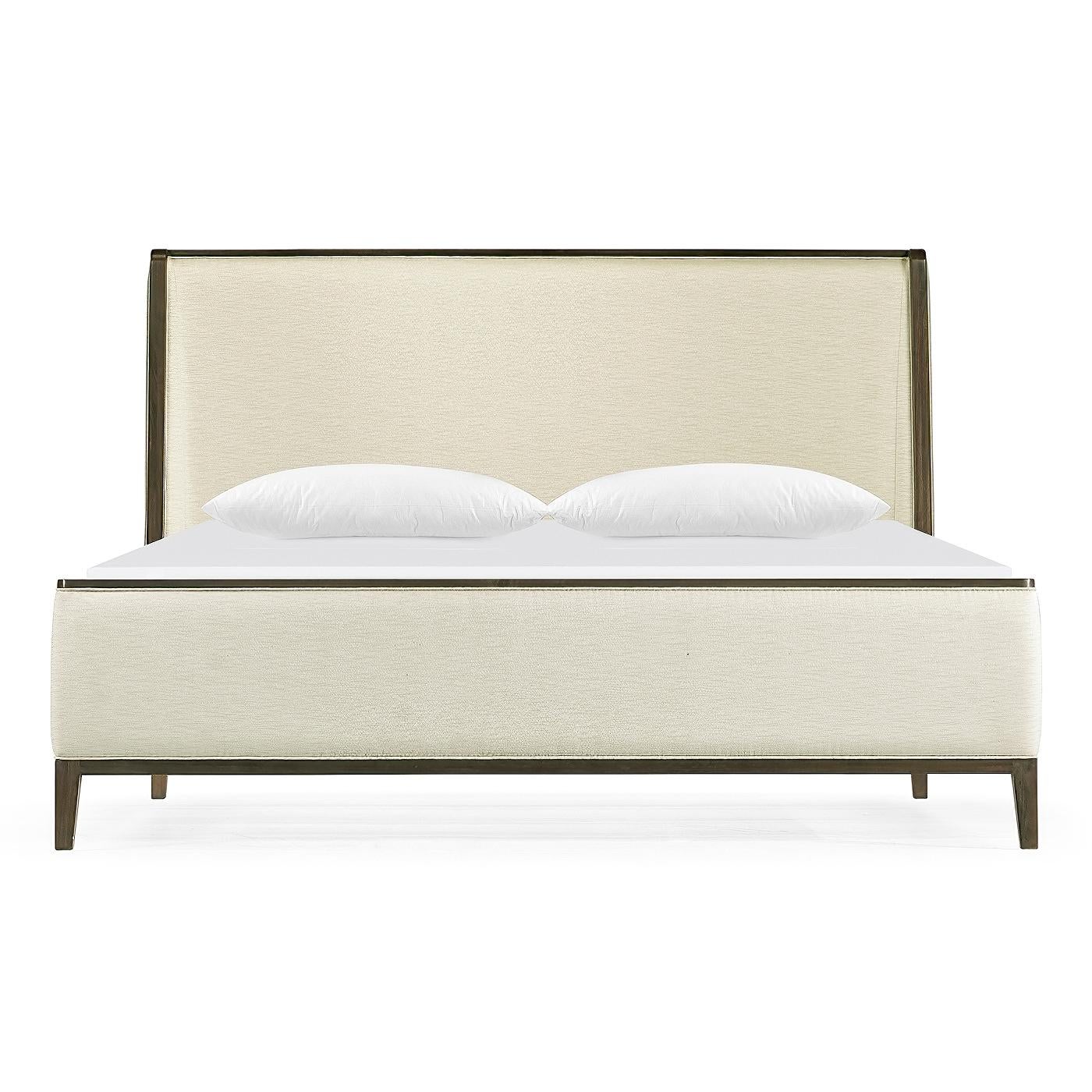 A modern upholstered king size bed with a greyed acacia frame, a winged back headboard, and raised on out flaring square tapered legs.

Dimensions: 65.33