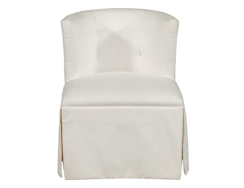 Modern sleek designed Parlor chair perfect for an accent in any room setting.
Great for a vanity or desk chair. Upholstered in a washable white stain resistant fabric, featuring a curved tufted back design.