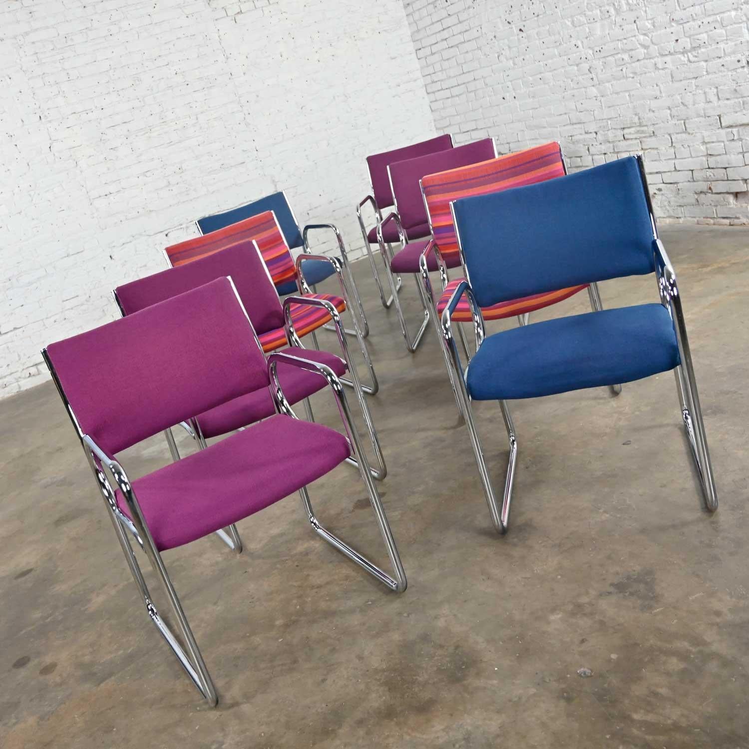 Stunning modern chrome armchairs by Vecta 4 purple, 2 blue, and 2 multicolored striped, set of 8. Beautiful condition, keeping in mind that these are vintage and not new so will have signs of use and wear. The top, upper back corners of the striped