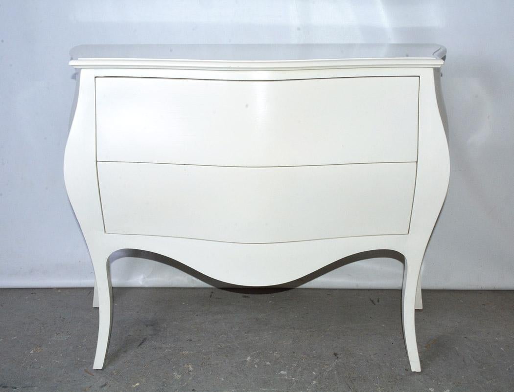 The modern chest with two drawers in the Venetian curvy or Bombe style is hand-crafted, as well as hand-painted in glossy cream. Picture it in the living room or bed room or even the entrance hall.