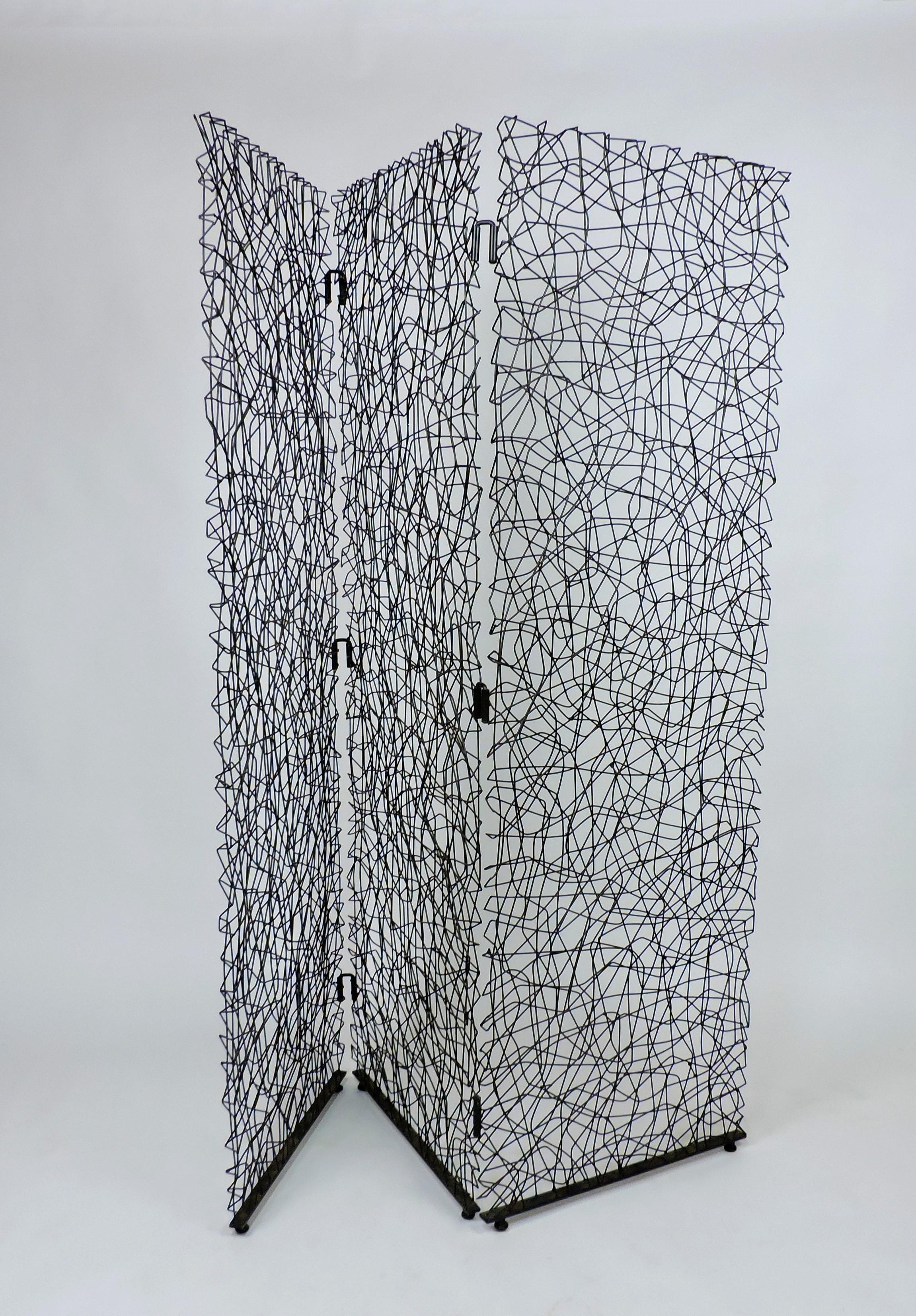 Very cool modern three-panel room divider. This sturdy and well made screen is made of metal wire that's arranged in an intricate and lacy abstract design. A beautiful way to create a room division. Each panel is 72.5 inches high by 24 inches wide