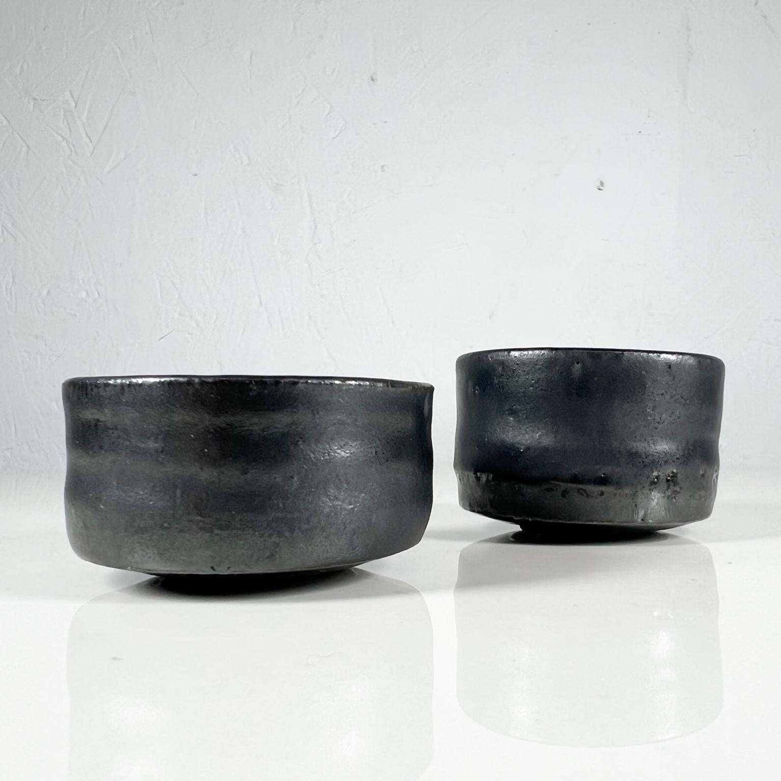 Modern Vintage black pottery Art sculptural mini vases dipping bowls 
Tall 1.5 tall x 2.25 diameter Small 1.25 tall x the x 2.25 diameter
Preowned unrestored vintage condition.
See images provided.
 