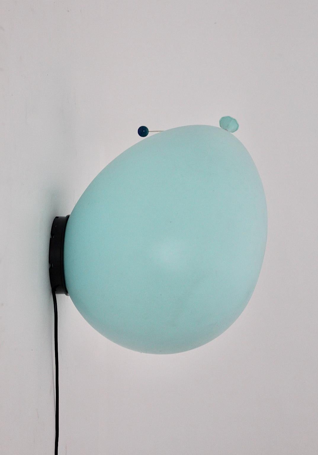 Modern vintage blue flushmount or sconce, which is colorful and nice.
Yves Christin designed the iconic lighting for Bilumen Italy in the 1980s.
The flushmount could also mounted as a sconce. The lamp shade was made of light blue polyurethan, while