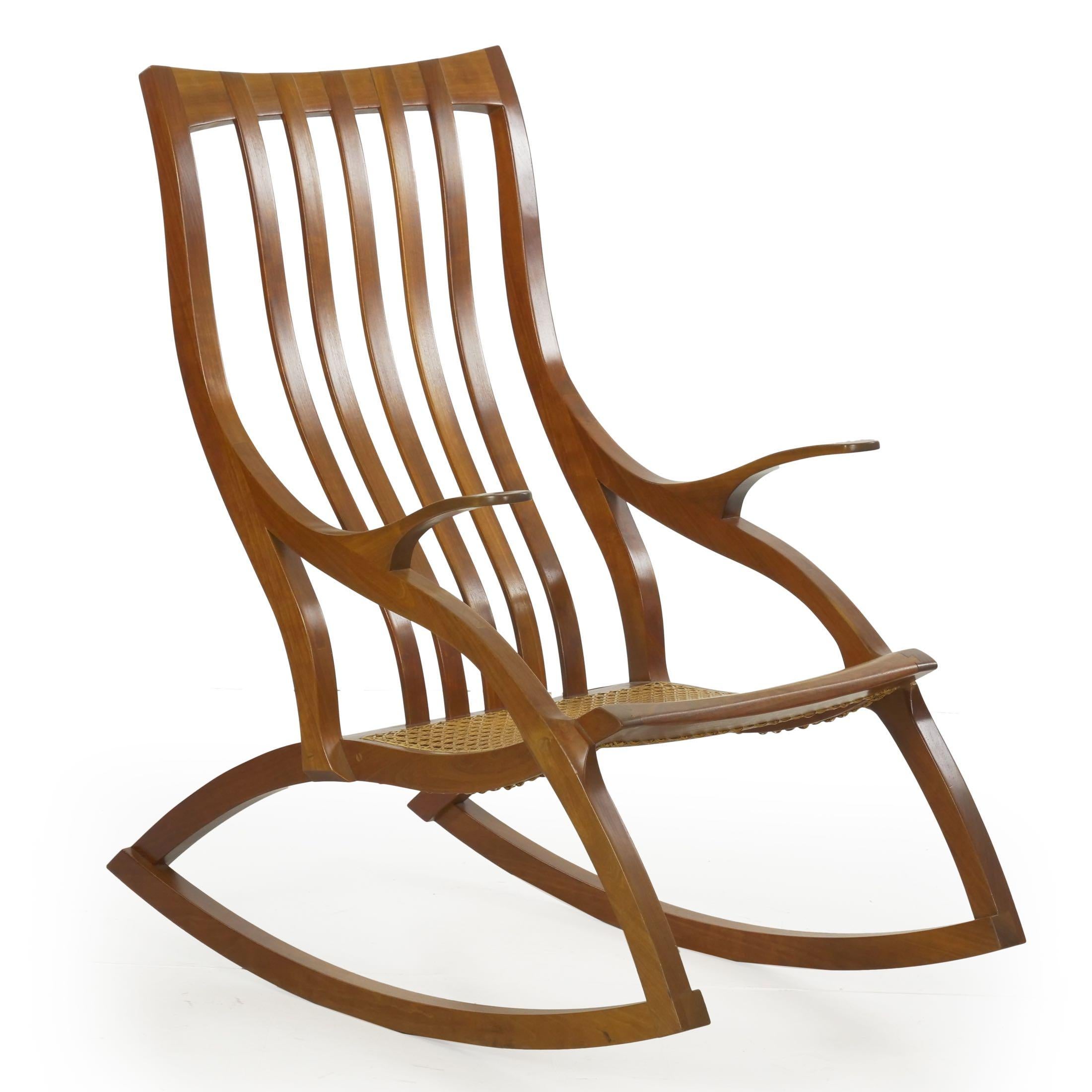 A finely handcrafted studio made modern rocking chair, it is a fascinating chair for its relentless curvature and distinctive side profile. This is perhaps where the chair presents most powerfully, as the intensity of the cyma-curve is most evident