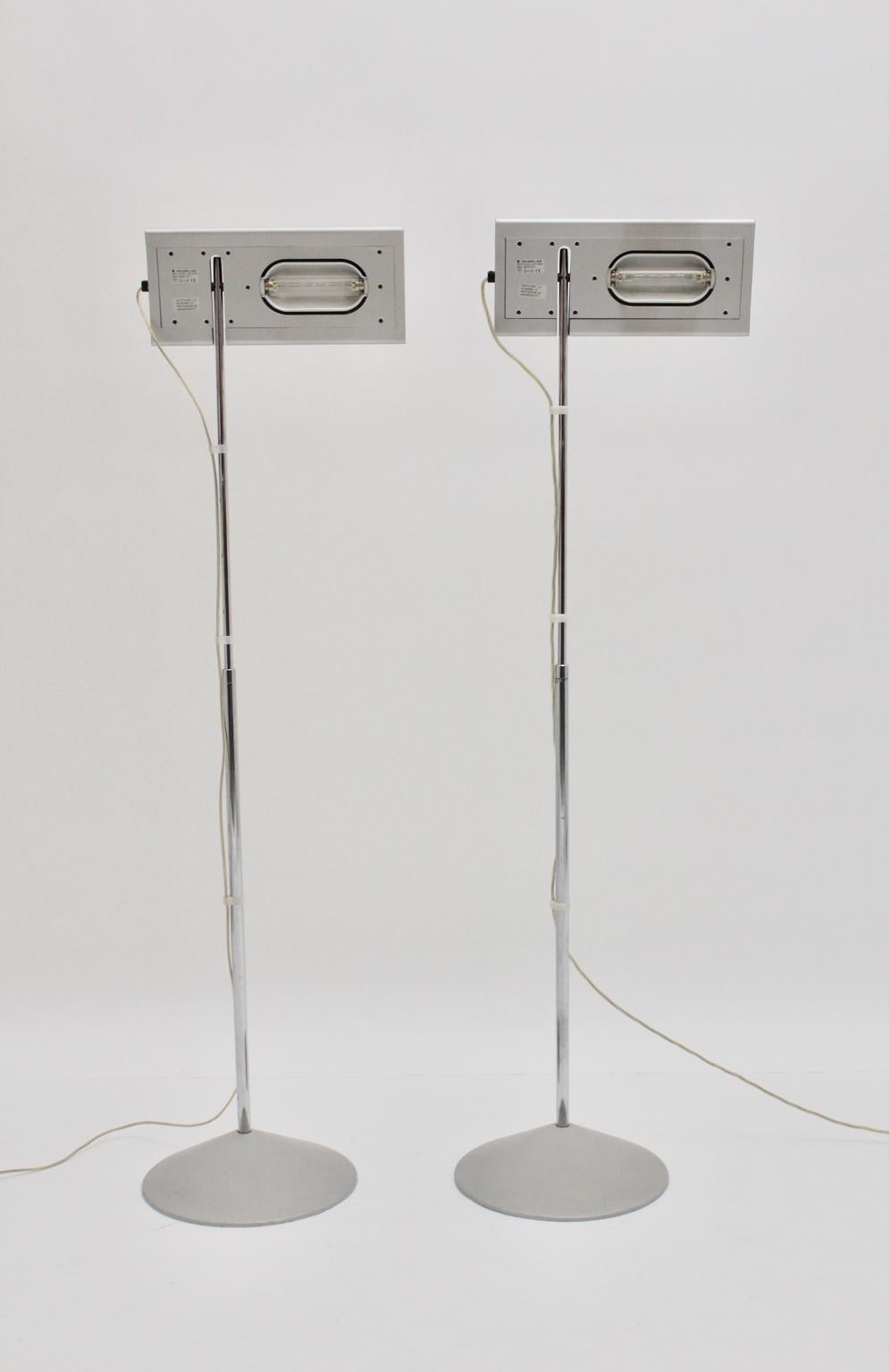 Modern grey pair of vintage floor lamps Duna designed by Mario Barbaglia and Marco Colombo 1980s and executed by Italian Luce. Stamped
The shade is adjustable and also the stem is adjustable from 141 cm to 200 cm. Additionally the lamp is dimmable