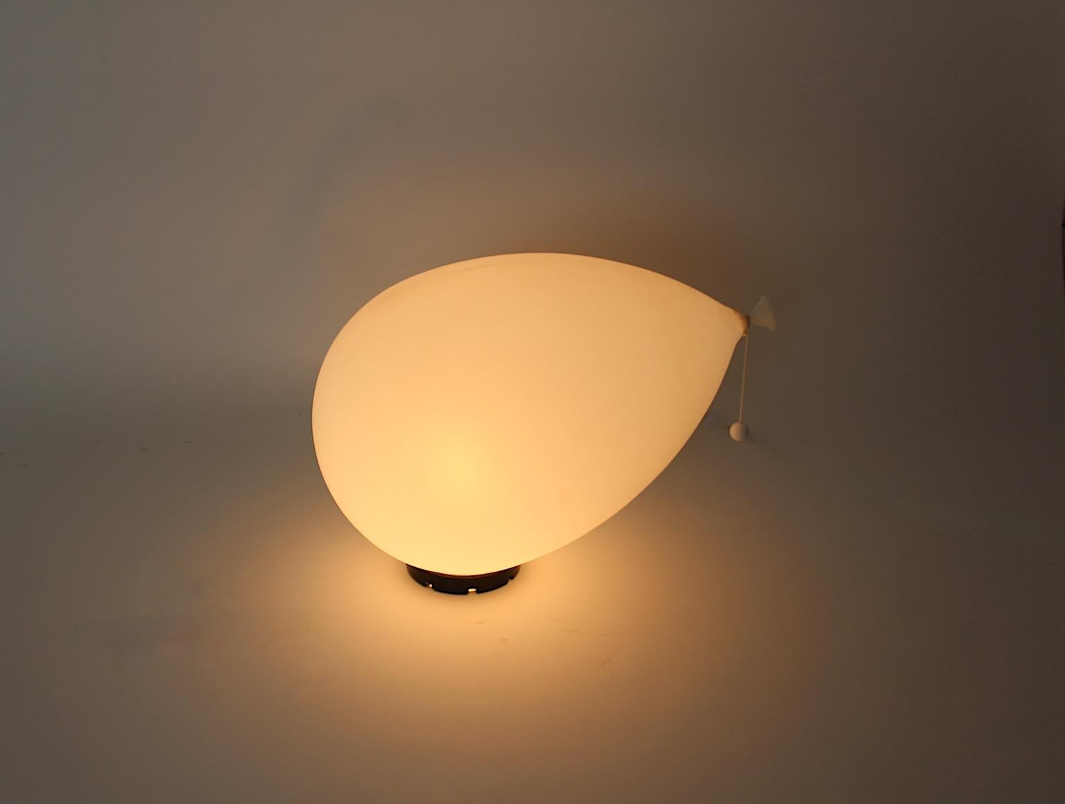 Modern vintage large white balloon flush mount sconce or table lamp by Yves Christin for Bilumen 1980s Italy.
An amazing lighting by Yves Christin for Bilumen 1980s Italy balloon like in white color with black mounting base stamped with company's