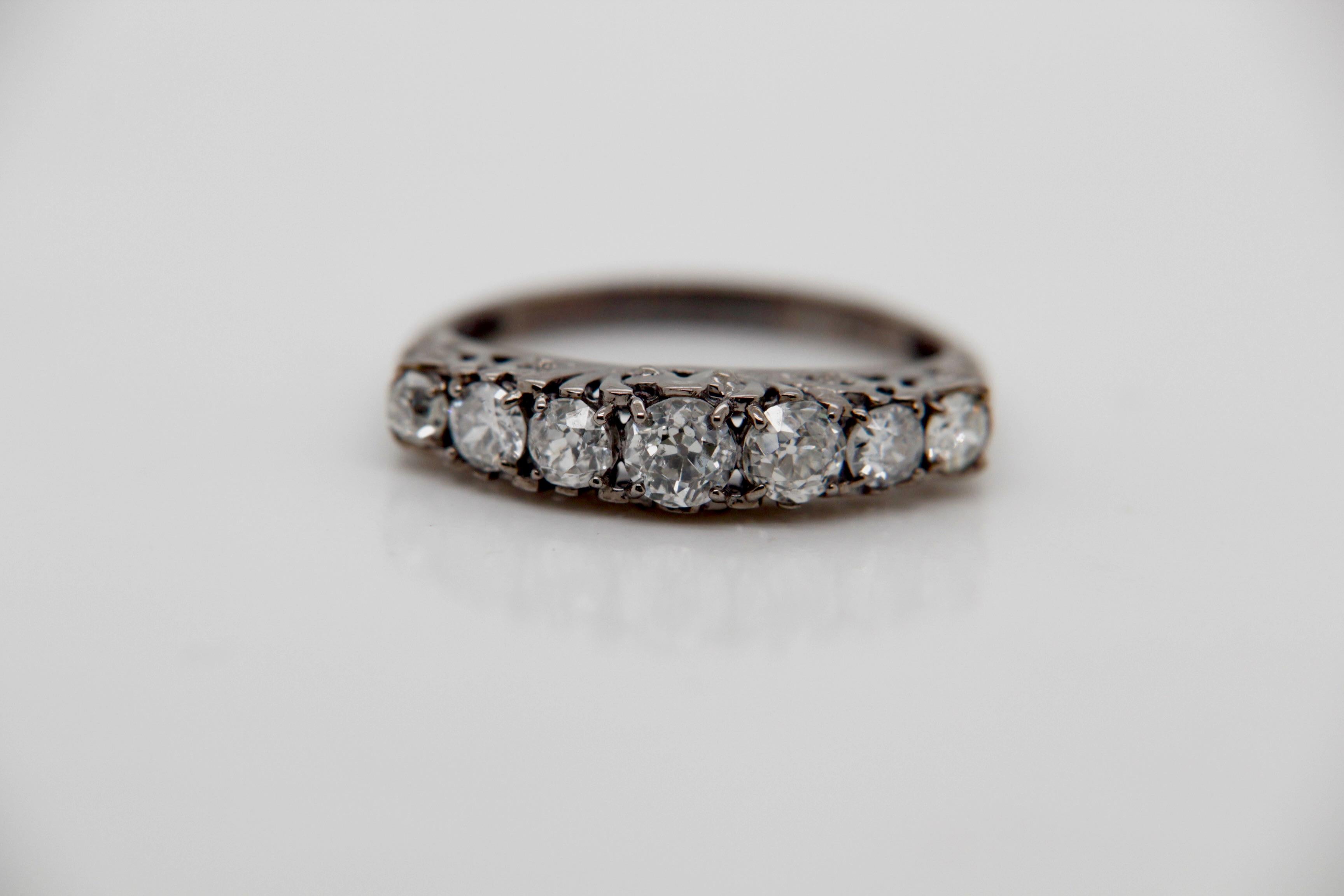 Experience the timeless allure of the Natural Old Mine Diamond Ring by Rewa, a modern vintage masterpiece that pays homage to the Victorian era's exquisite jewellery design. This stunning ring showcases a total of seven exceptional diamonds,