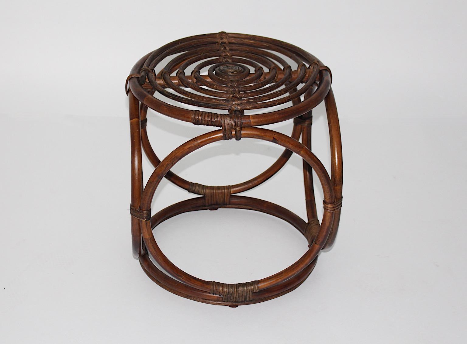Organic Modern Riviera Style vintage stool from brown stained bamboo, 1970s, Italy.
An amazing composition from beautiful brown stained bamboo connected with bamboo rings.
This bamboo stool is characterized through wonderful patina and very good