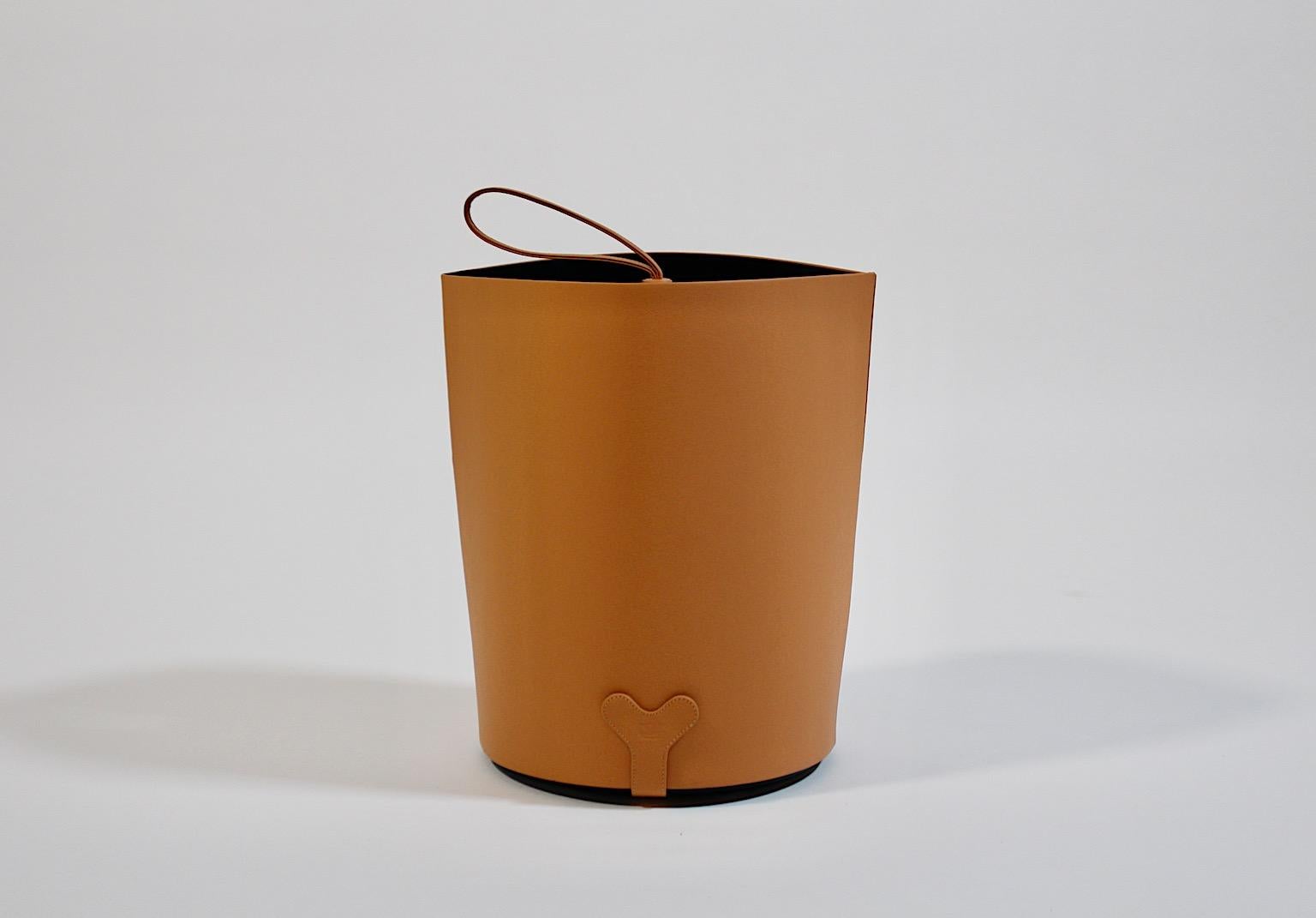 Modern vintage umbrella stand or cane holder from cognac brown real leather by Poltrona Frau circa 2000, Italy.
A beautiful vintage luxurious umbrella stand by Poltrona Frau from cognac brown high quality leather with plastic inlay.
This very