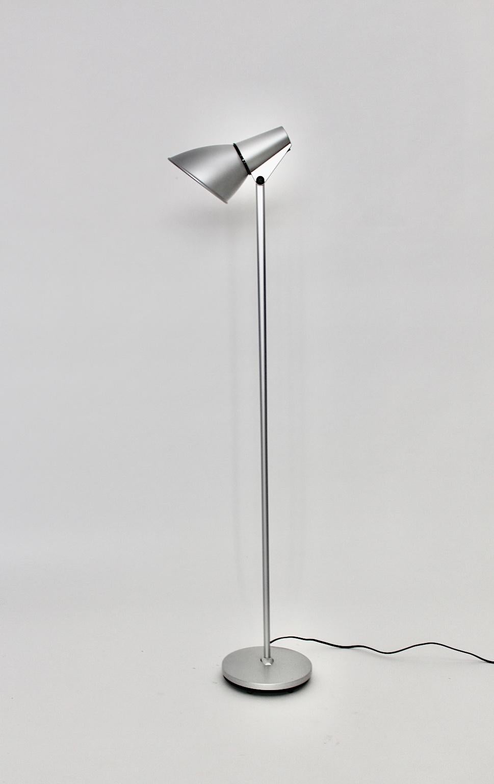 Modern vintage silver lacquered aluminum and steel floor lamp designed by Hannes Wettstein 1996 for Artemide Pregnana Milanese, Italy.
The shade is adjustable in all directions. Also it is labeled, while the switch on / off sits at the shade.
The