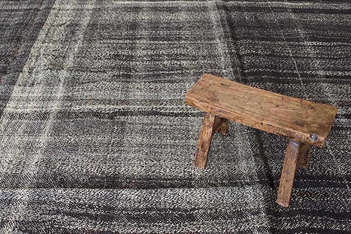 This vintage Kilim was impeccably handwoven in the east part region of Turkey and it provides a modern effect with great visual impact. The design captures both, elegance and raw beauty. Just unique and authentic, beautiful layered over sisal rugs,