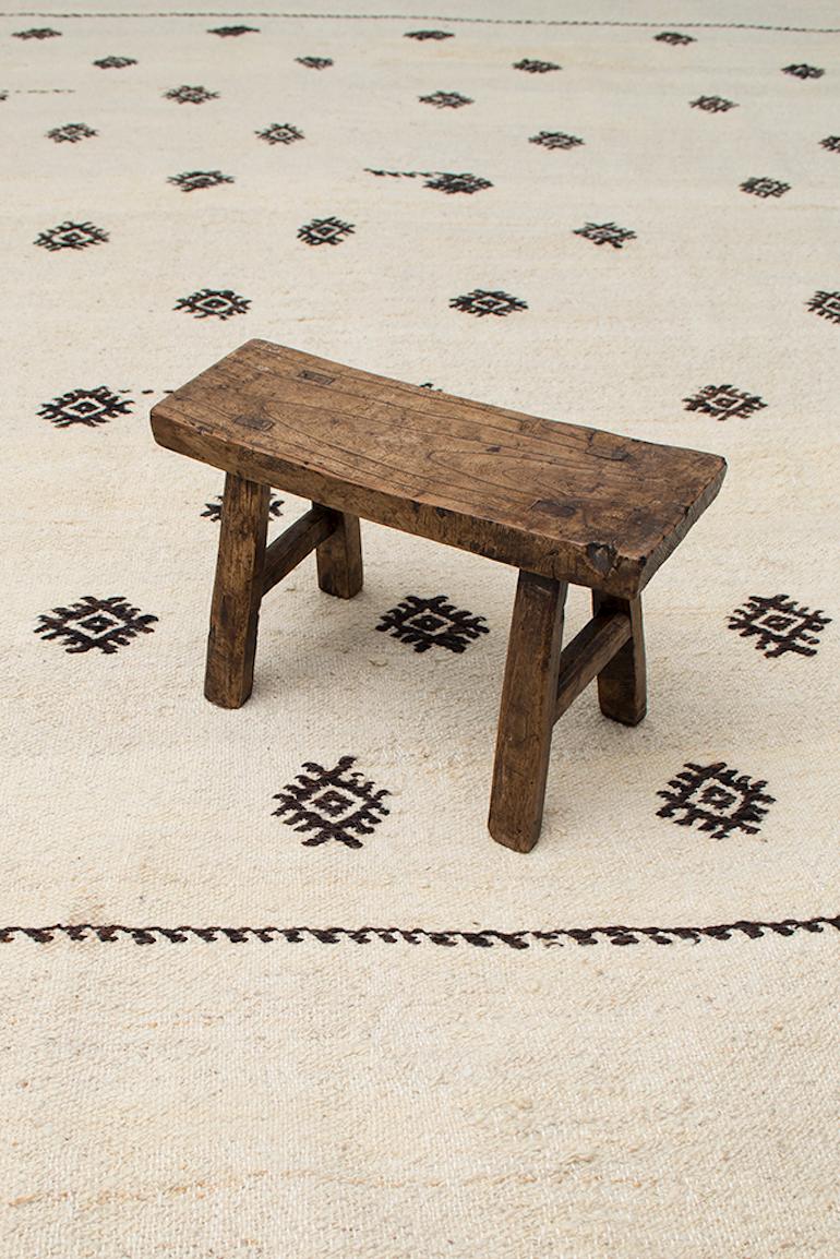 This vintage small Kilim is simple in design yet so elegant with its beautiful color and an abundance of cleverly placed hand-embroidered tribal motifs. This design captures both, elegance and raw beauty. Just unique and authentic. The most